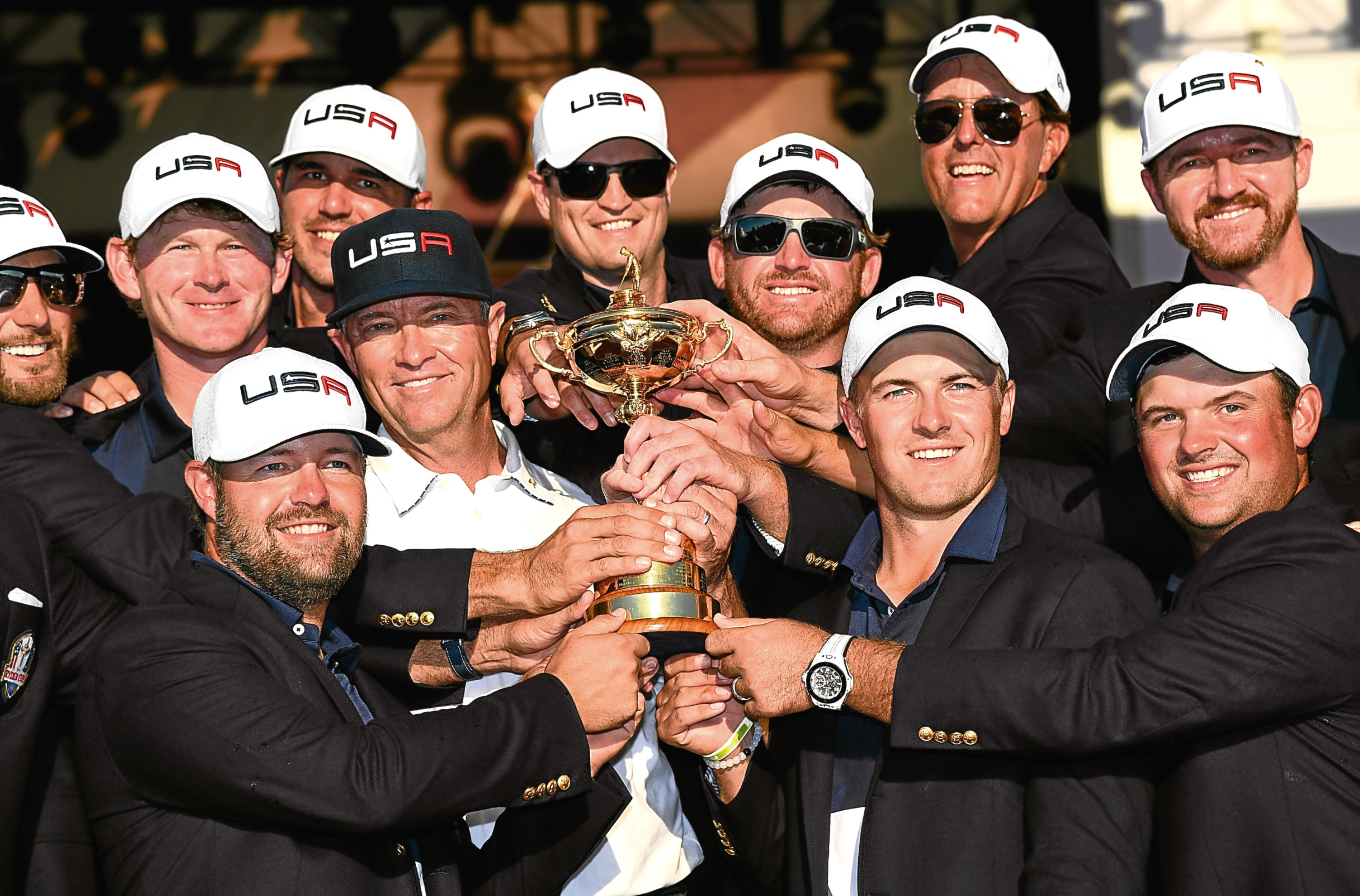 Davis Love (centre) with his victorious US team after their Ryder Cup win at Hazeltine.