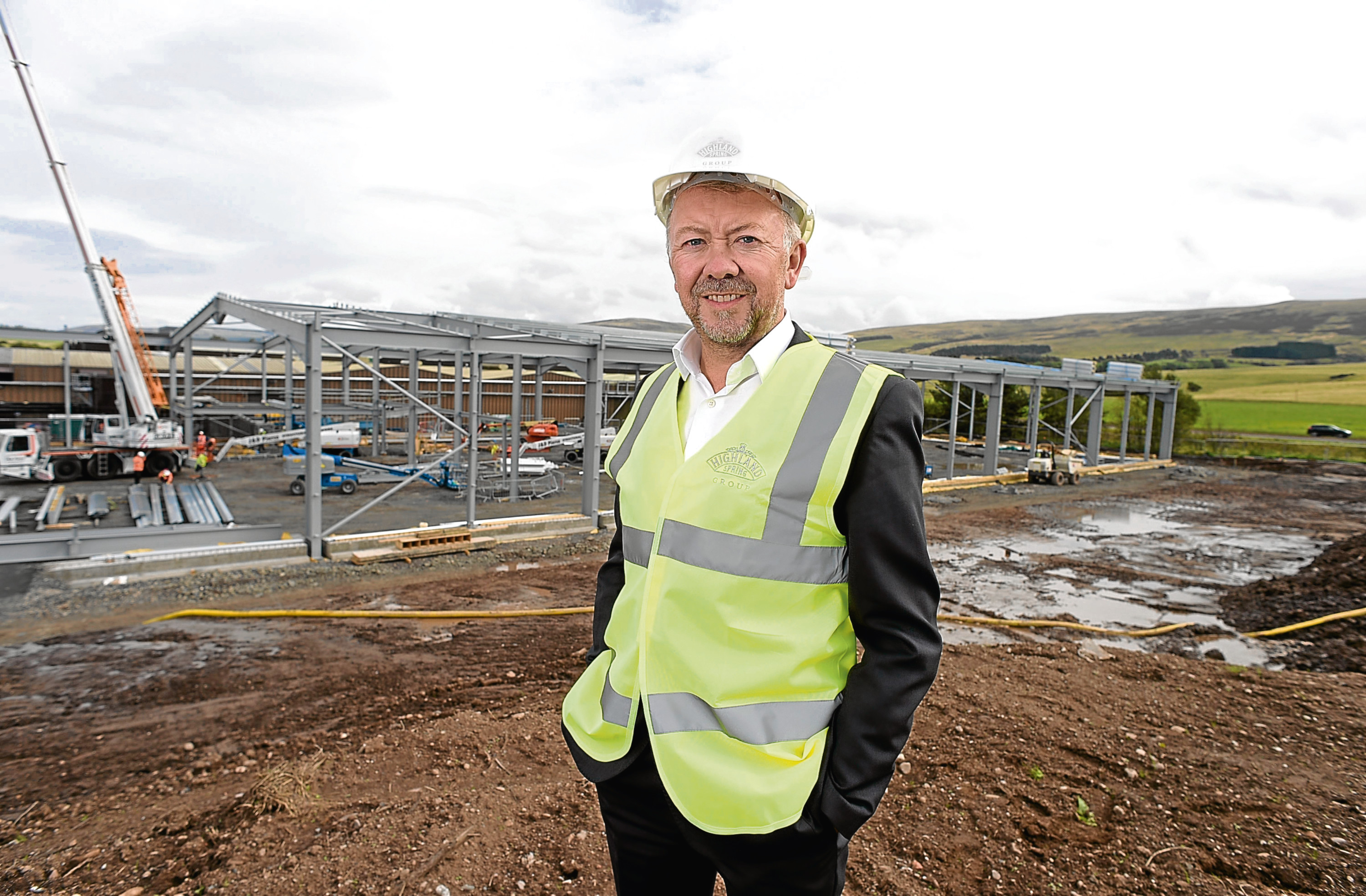 Les Montgomery, chief executive of Highland Spring Group, overseeing construction work on a new bottling facility at its Blackford.