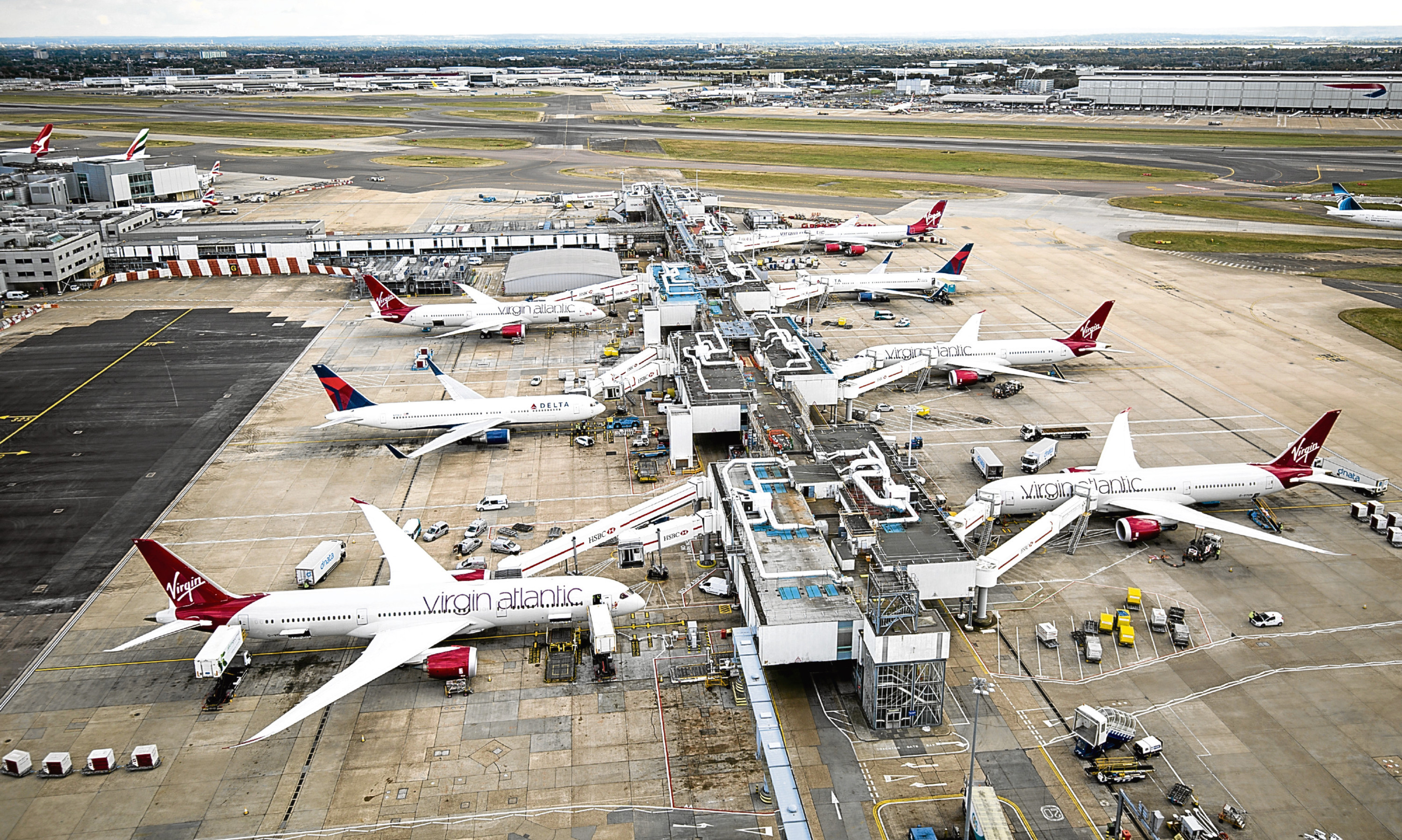 Aircraft wait on stands at Hathrow's Terminal 3