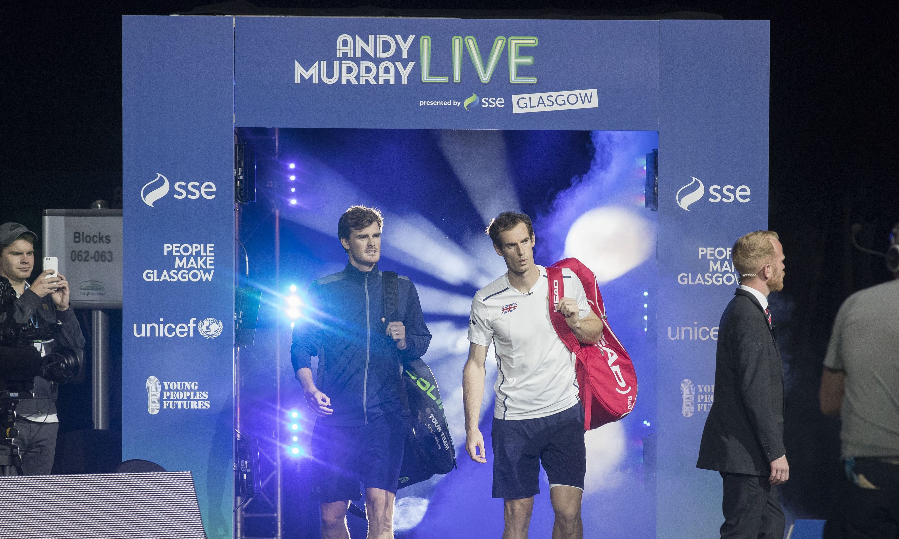 Jamie Murray and Andy Murray walk on to court during Andy Murray Live in September.