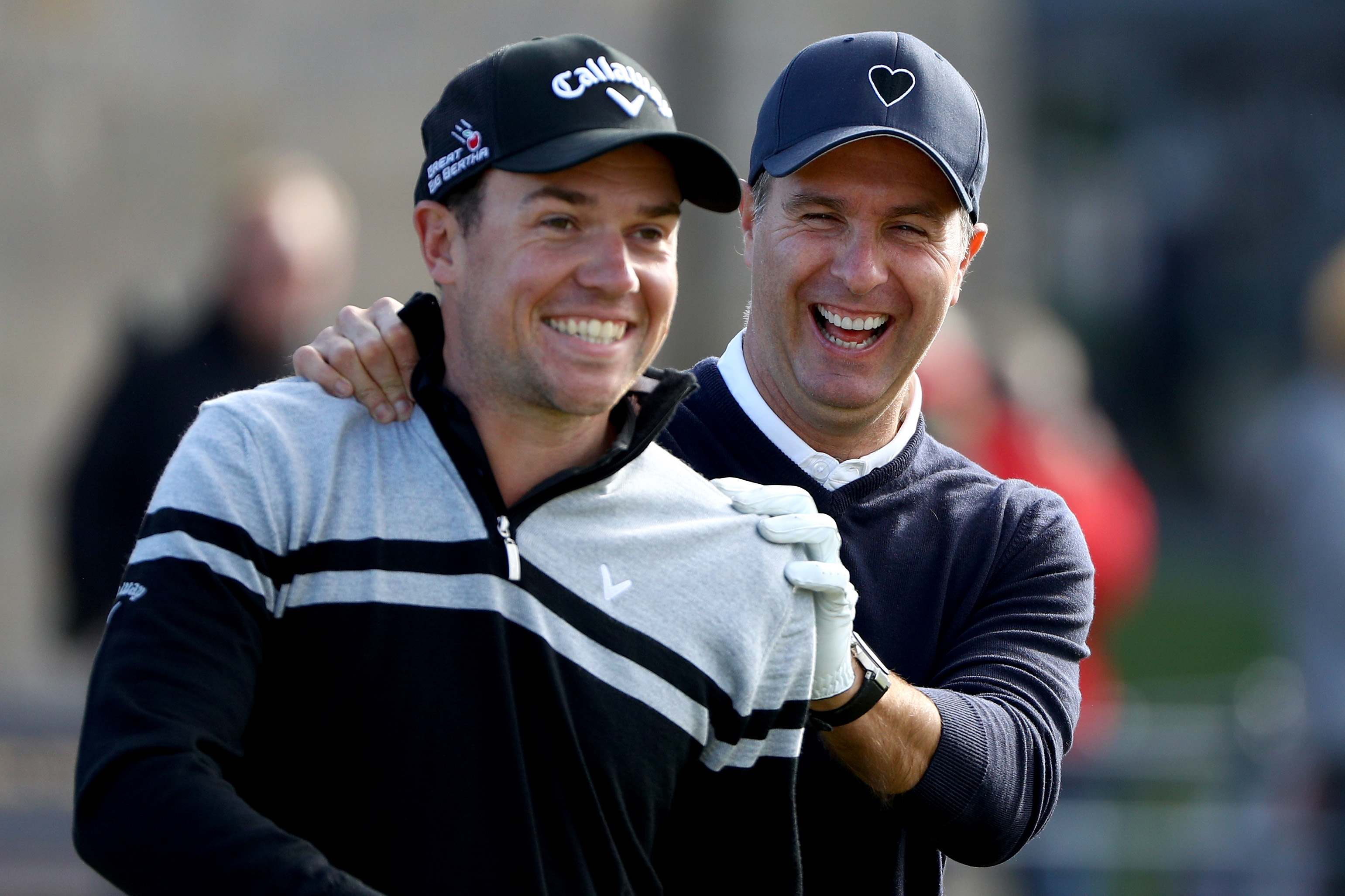 Former England cricketeer Michael Vaughan shares a joke with Jonathan Smart during a practise round for the Dunhill.