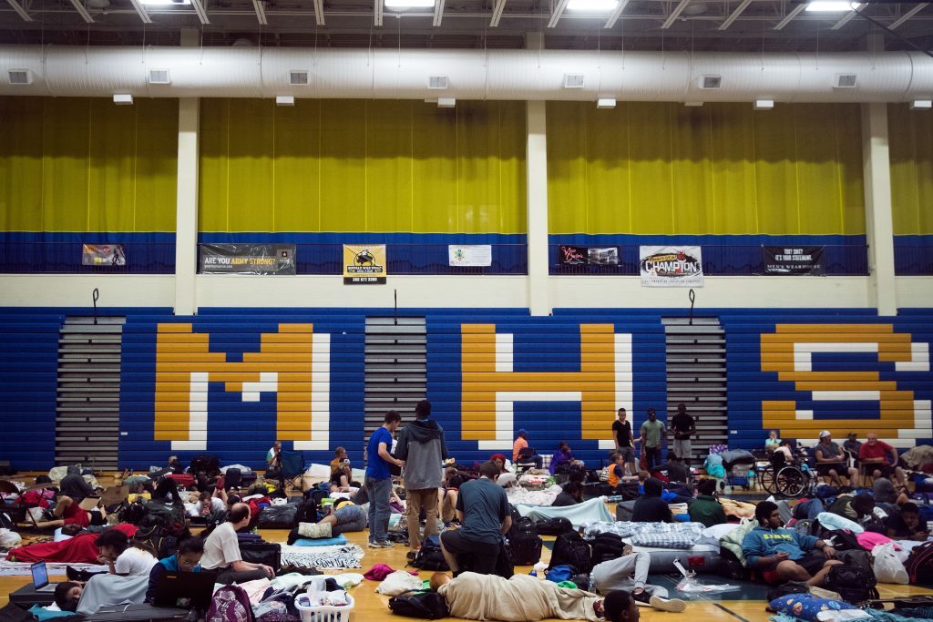 People take shelter from Hurricane Matthew at Mainland High School in Jacksonville, Florida. 