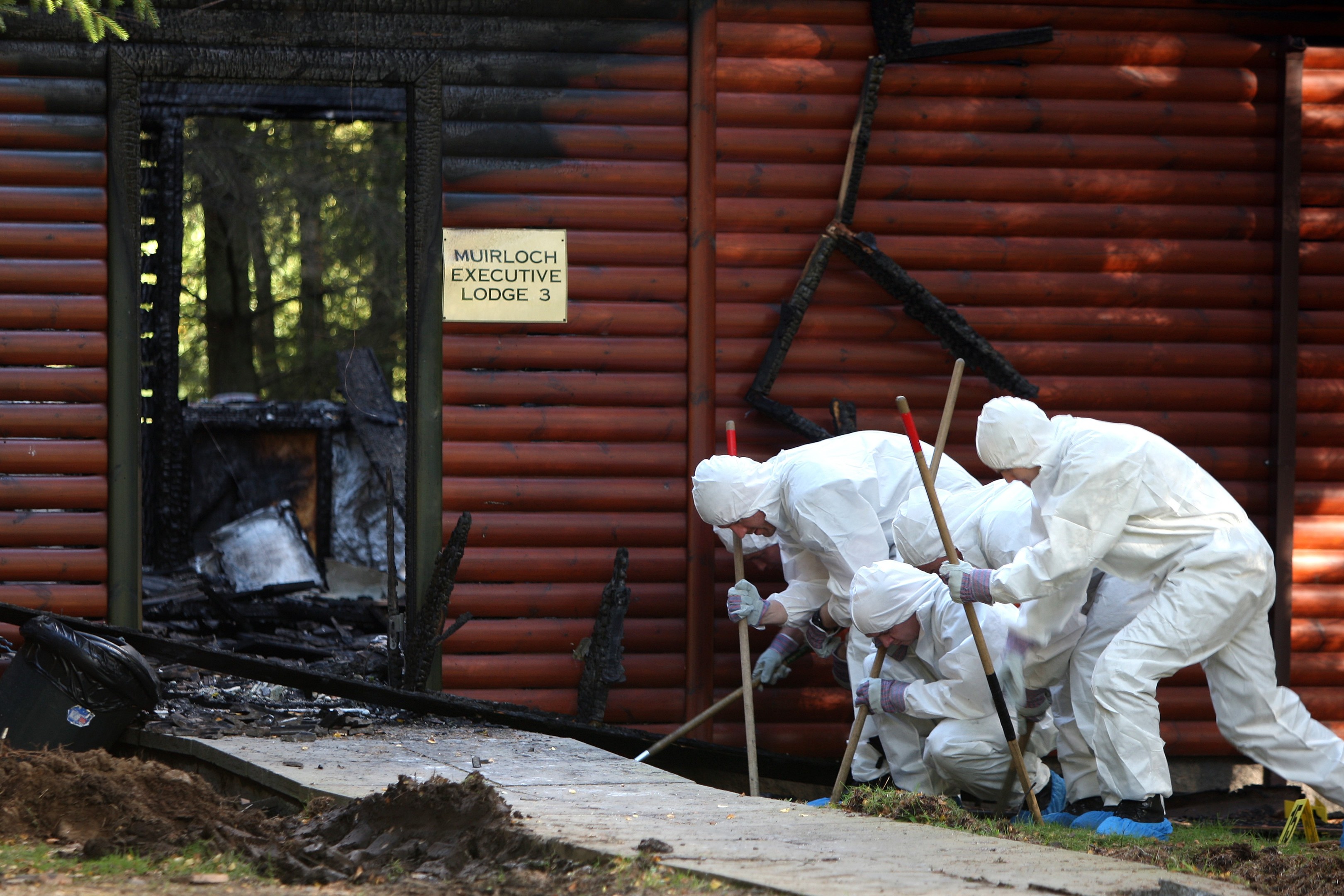 Police carry out a forensic examination of the lodge in 2015.