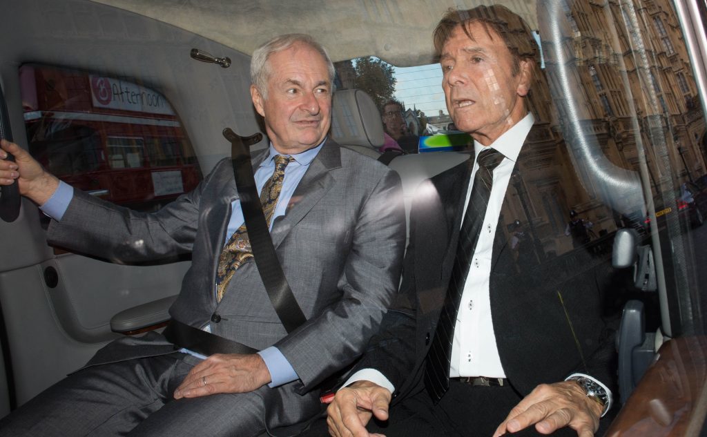 Paul Gambaccini and Sir Cliff Richard  leave the Palace of Westminster in central London, after meeting MPs and Peers to warn them of the impact of being wrongly accused of sex crimes.