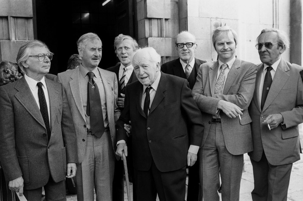 Members of the cast of Dad's Army, at St Martin-in-the-Fields Church after a memorial service for the actor Arthur Lowe who played Captain Mainwaring in the programme (left to right) Clive Dunn (Private Jones), Bill Pertwee (ARP Warden), Jimmy Perry (author), Arnold Ridley (Private Godfrey), Frank Williams (The Reverend Timothy Farthing), Ian Lavender (Corporal Pike) and John Le Mesurier (Sgt Wilson), pictured in 1982