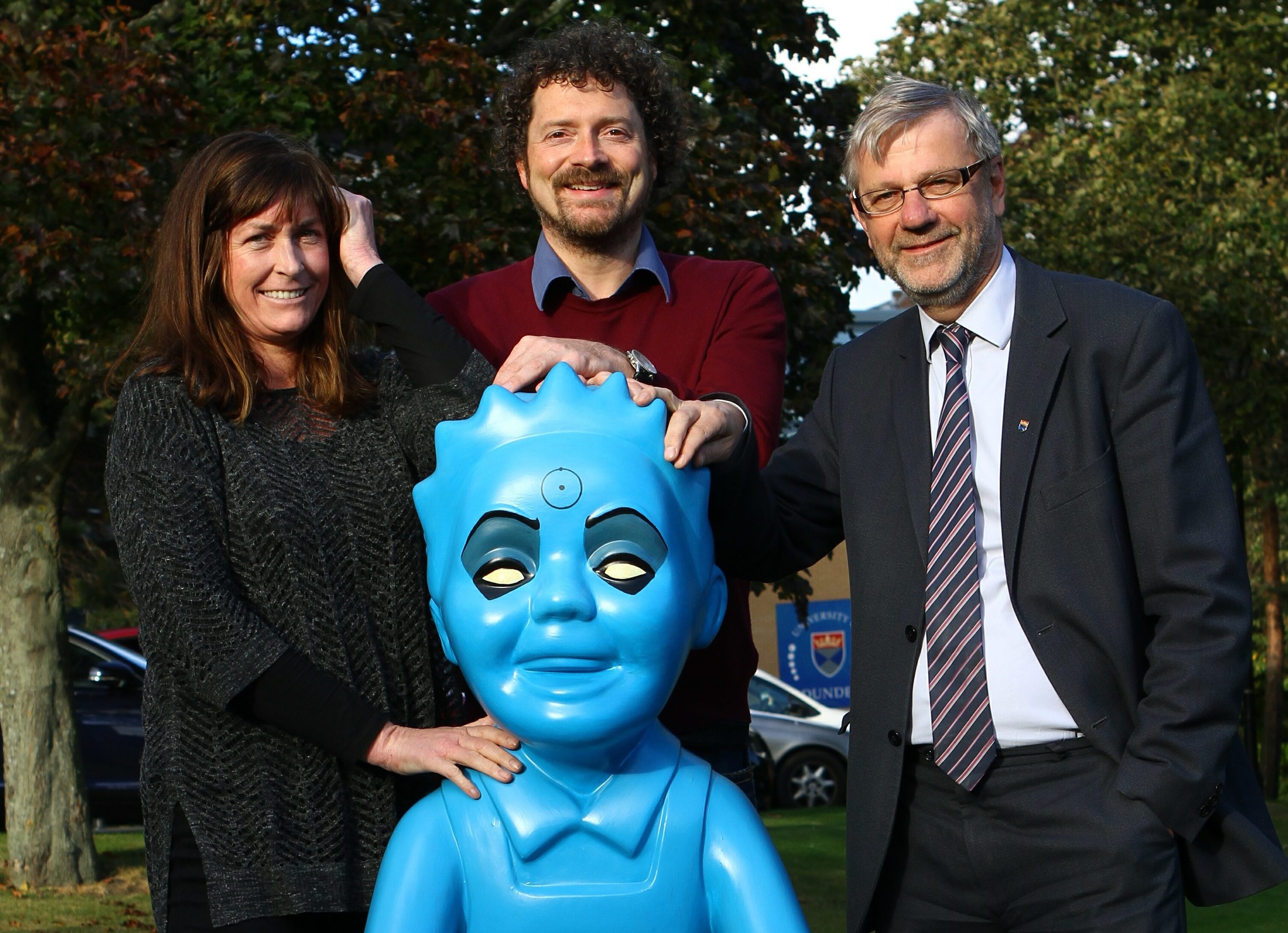 Chris van der Kuyl and wife Heather pose with Dr Manhattan Wullie and Prof Sir Pete Downes