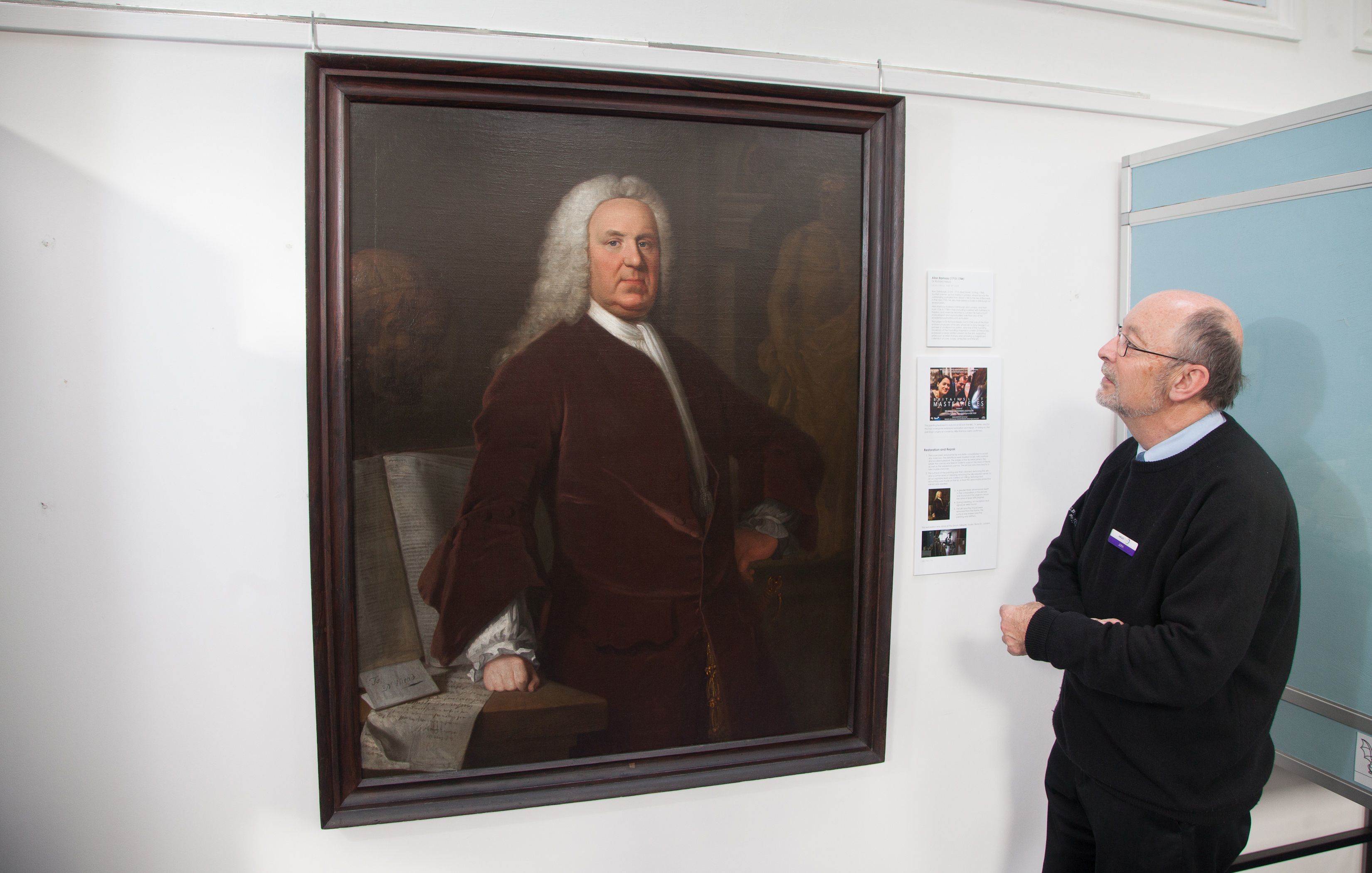 Scottish painter Allan Ramsay's portrait of Dr Richard Mead is examined by at ANGUSalive’s collections officer John Johnston at Montrose Museum.