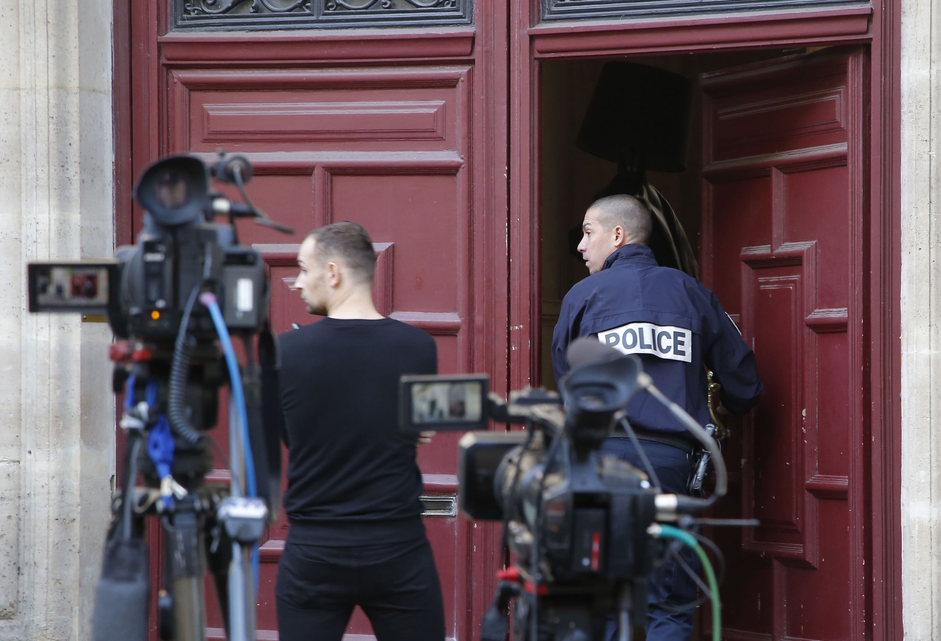 A French police officer enters the residence of Kim Kardashian West in Paris.