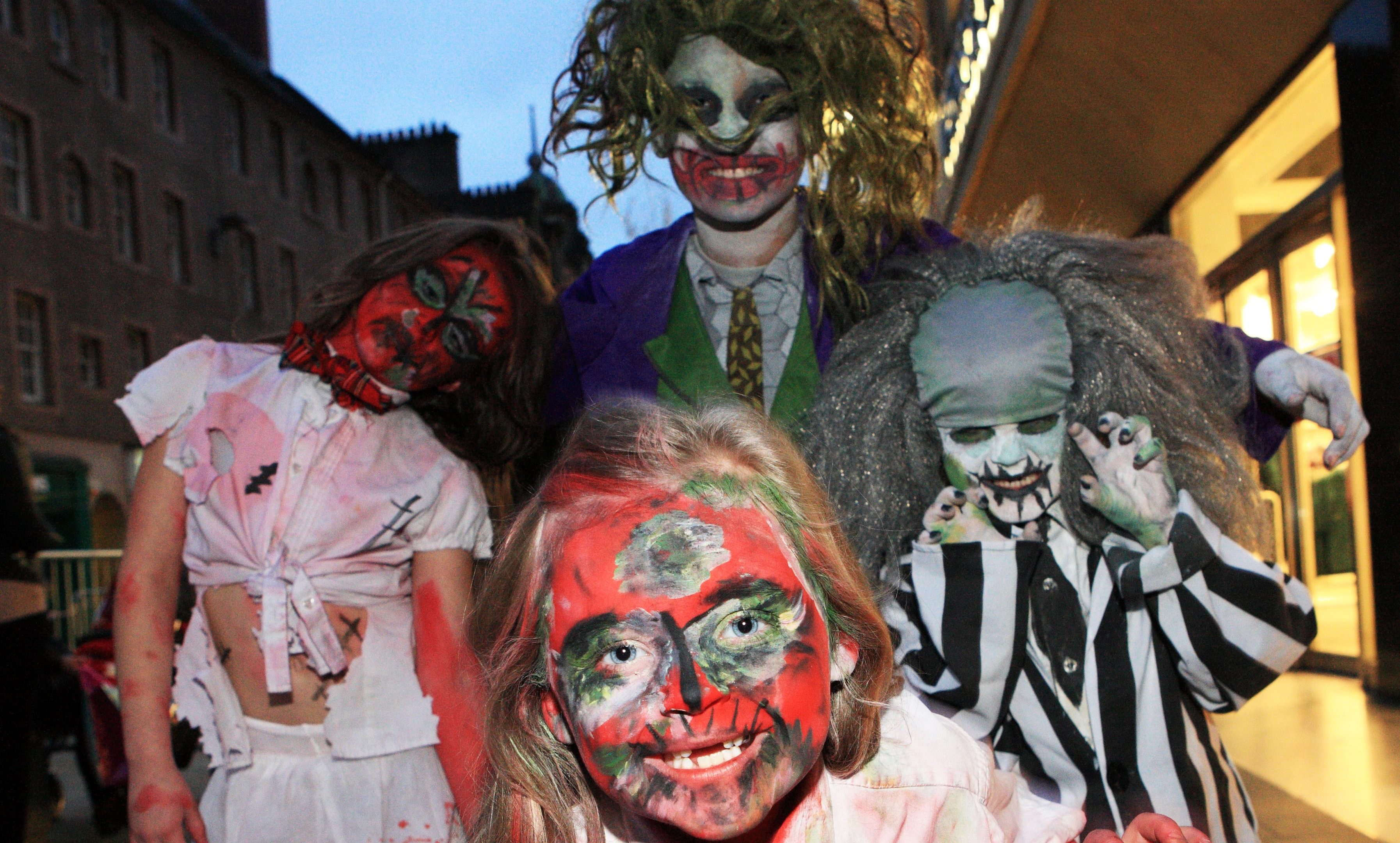 The halloween parade in Perth on saturday  'Zombie' Storm Macleod leads Atlanta Macleod (L) Kayleb Lochrie (B) Mark Macleod