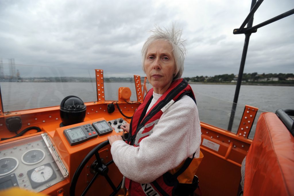 Crew member Fiona Johnston at the helm.