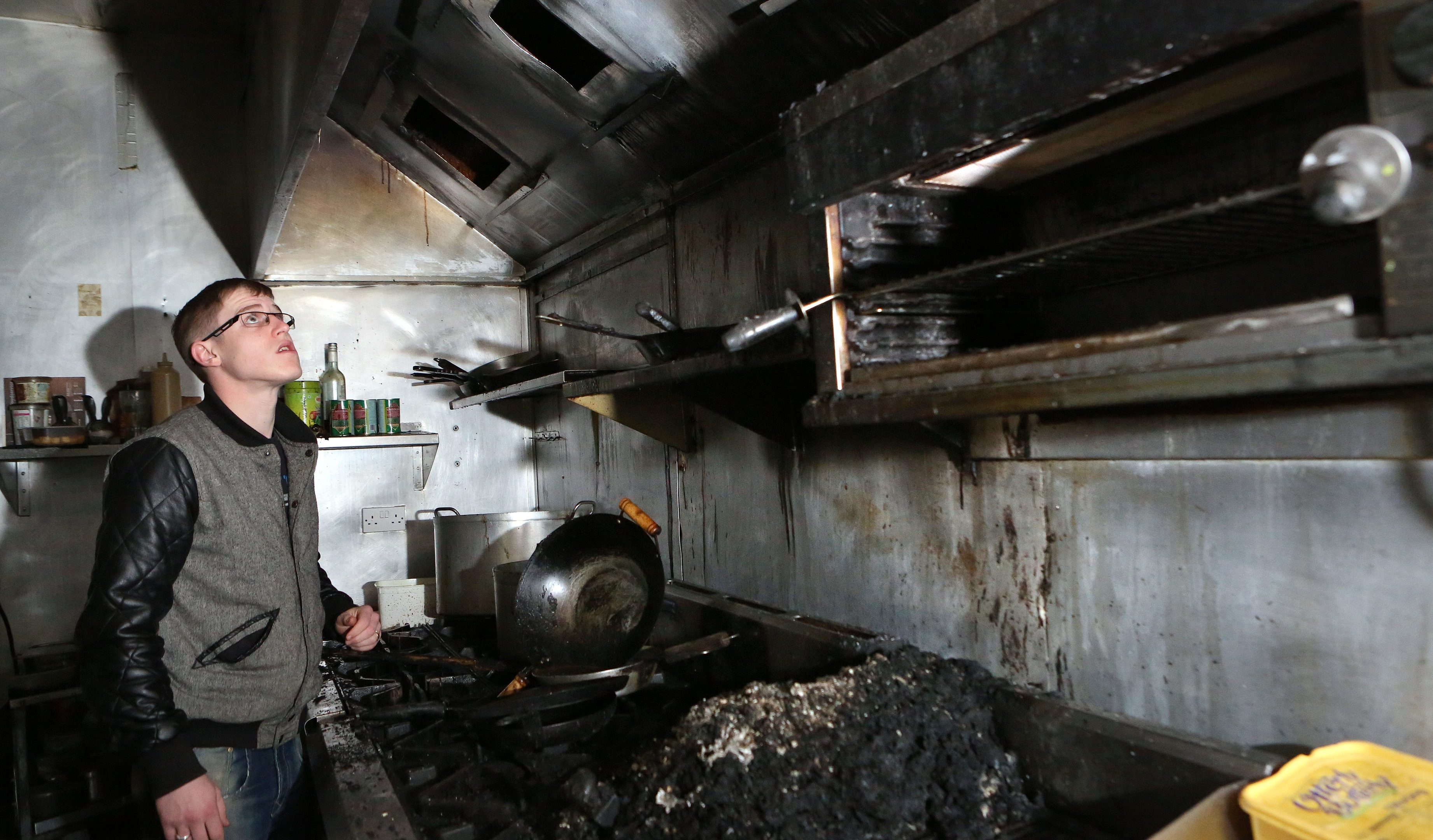 Staff member Kenny Hastie in the kitchen in the aftermath of the fire in Mint Restaurant