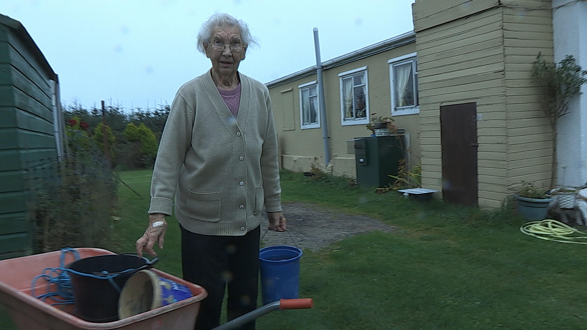 North east resident Molly Forbes collecting water from a stream in Baxter's follow-up documentary You've Been Trumped Too