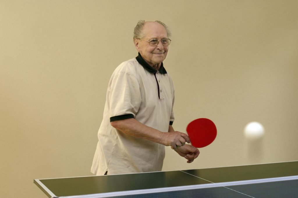 Grandfather playing ping pong