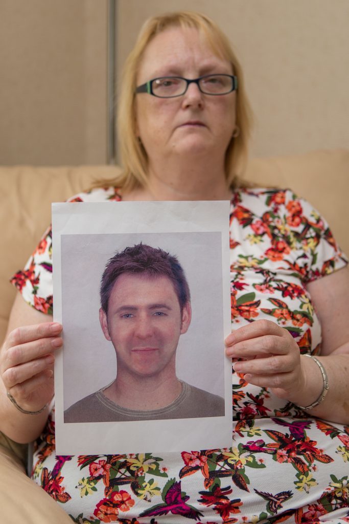 Kenneth Jones is shown in a Police E-Fit held by his long suffering mother. 