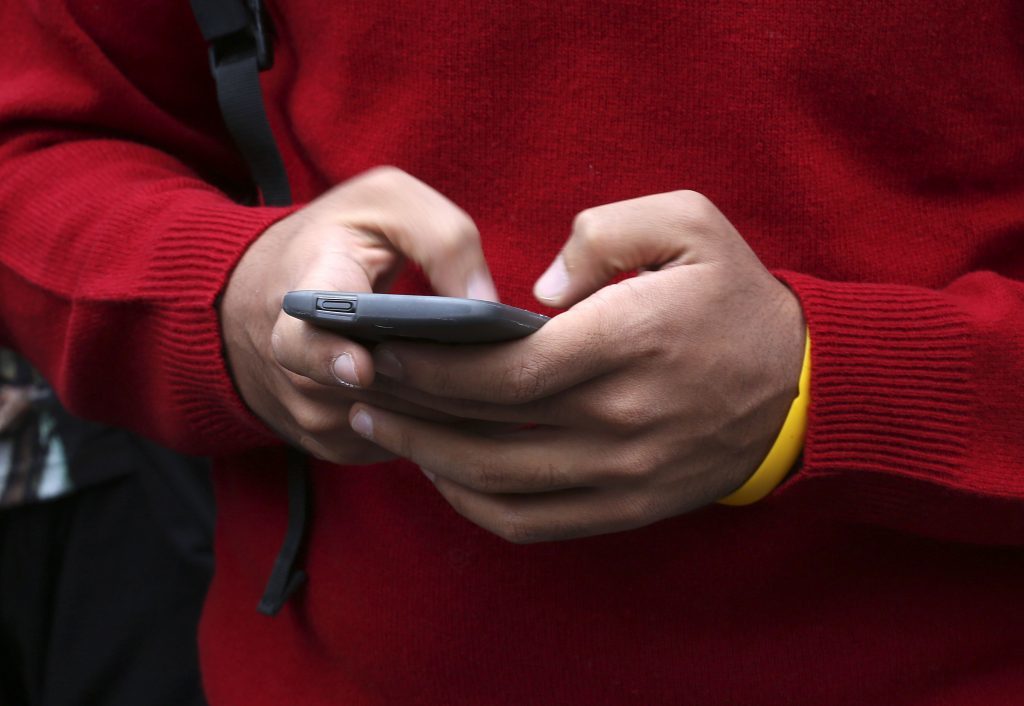 A man using a mobile phone.