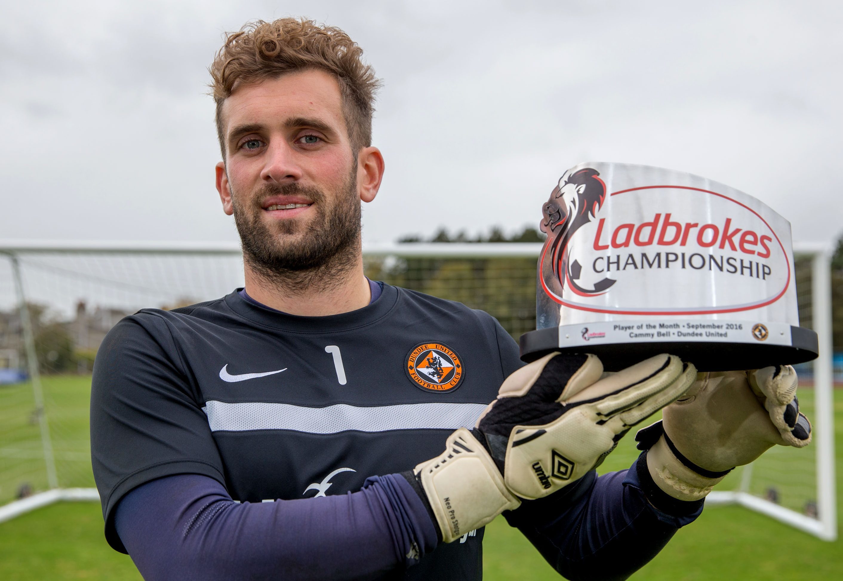 Cammy Bell with his award.