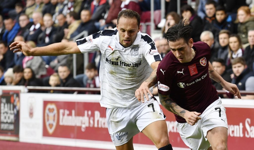 Tom Hateley, left, in action against Hearts.
