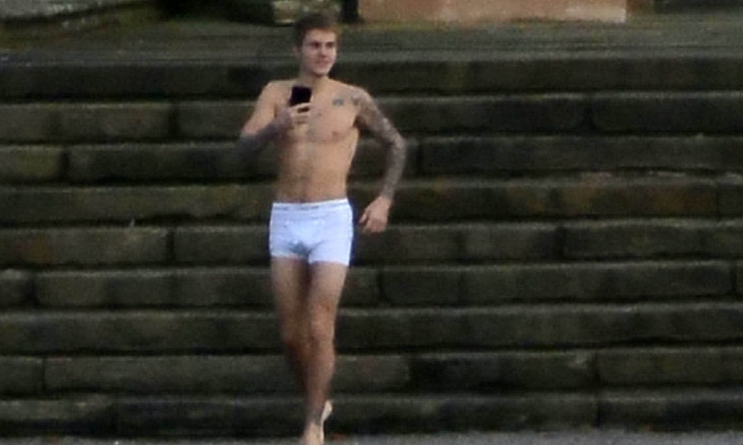 Singer Justin Bieber in his underpants outside Kinross House.