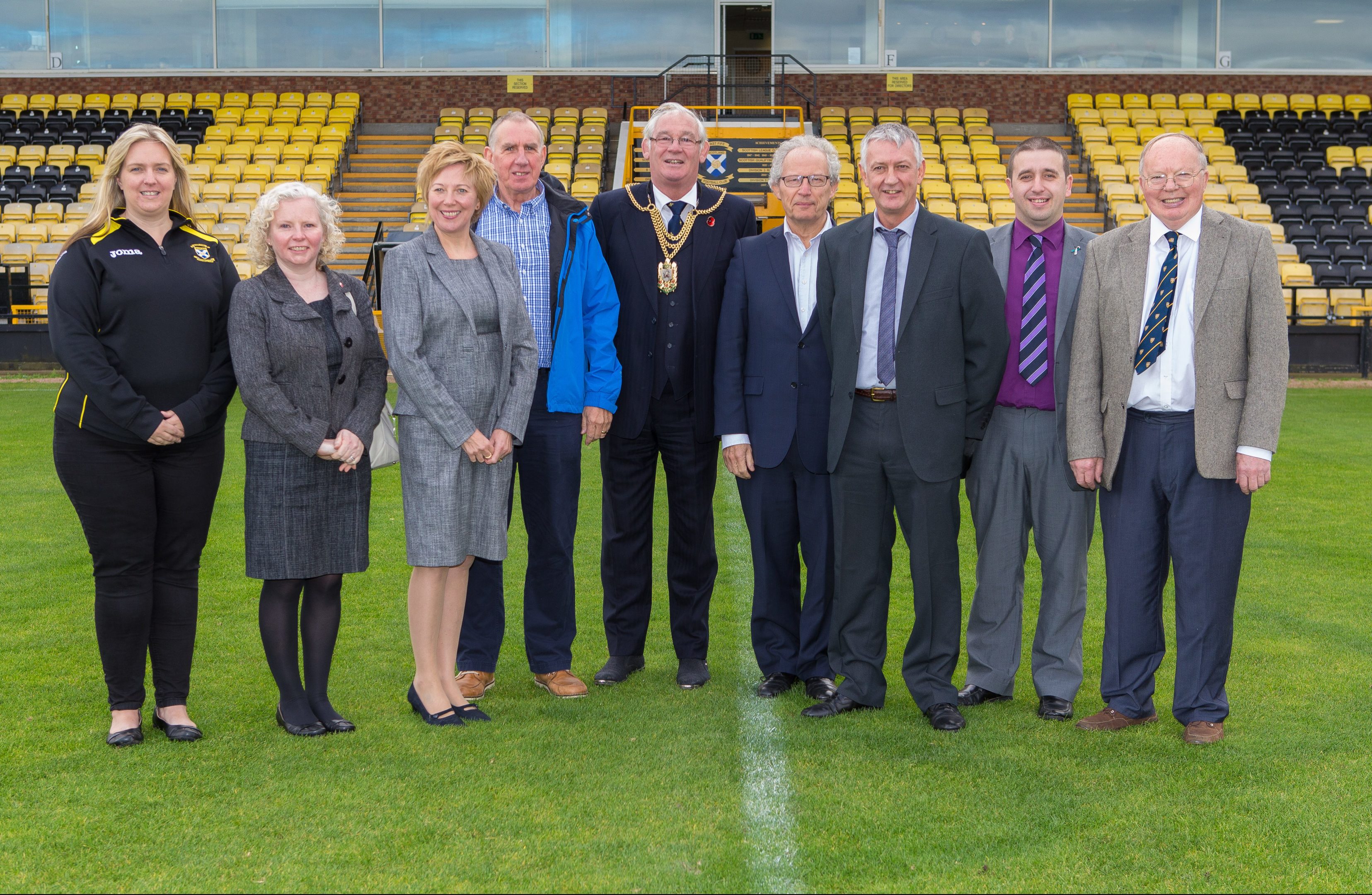 From left Lorna McCauley (Youth Academy), Councillor Claire Baker, Councillor Lesley Laird, Allan Duffy, Provost Jim Leishman, MSP Henry McLeish, Councillor David Graeme, Andrew Hutchison (FFTC) at Bayview Football Club where the turf will be replaced with astroturf material due to funding from Fife Council.