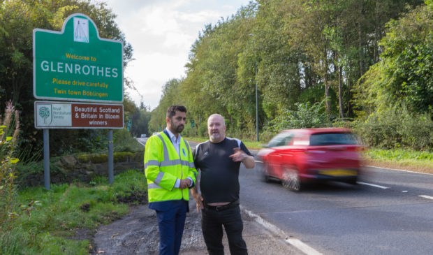 Rab Brown, right, with former Transport Minister Humza Yousaf at the site of Logans tragic death