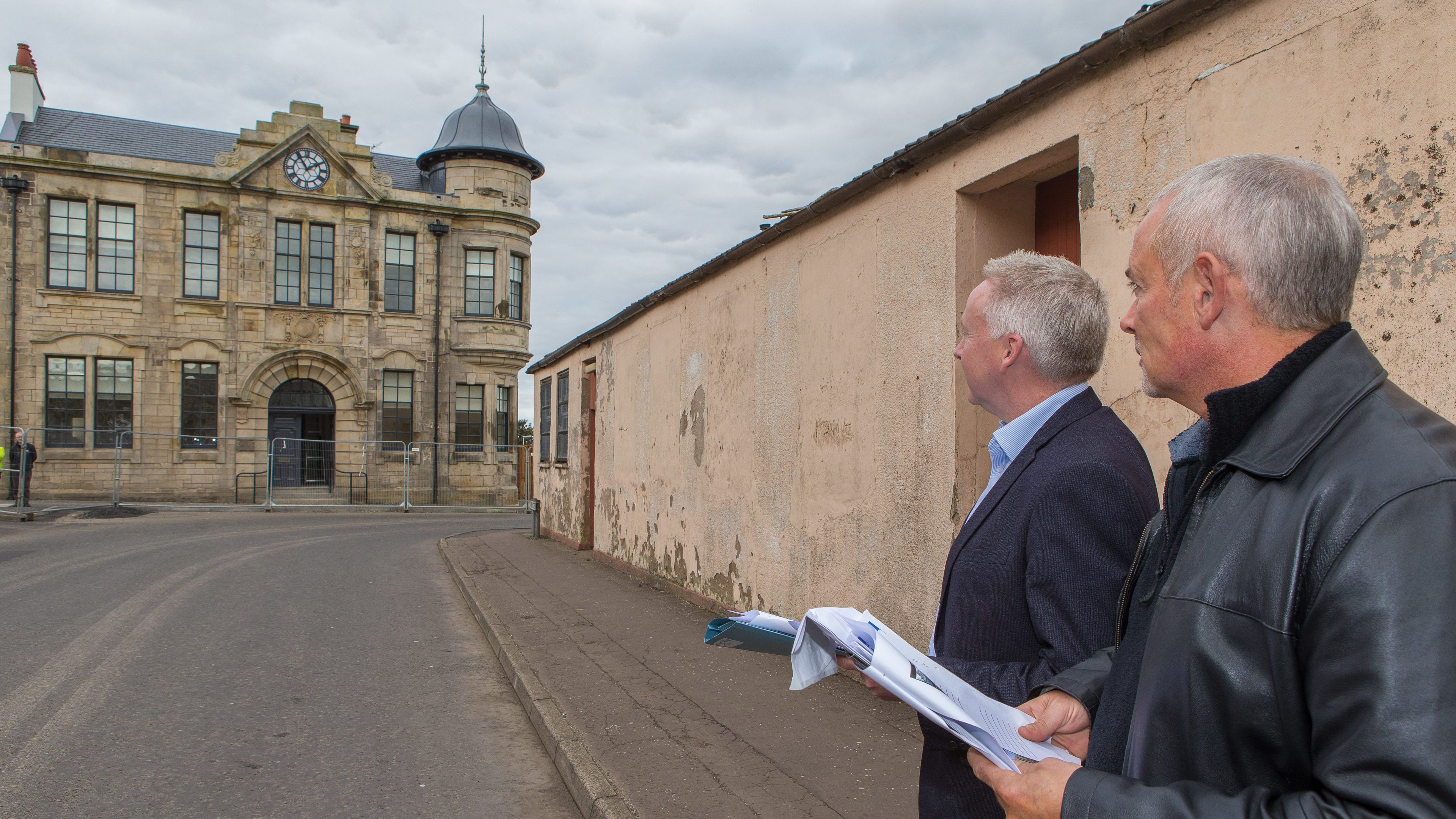 Judges Fraser Carlin and Phil Prentice   view Lochgelly's Town House development
