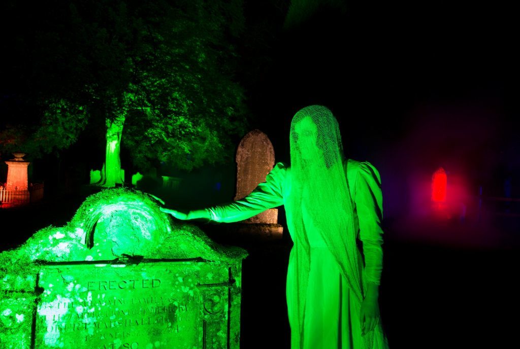 A ghostly woman roams the graveyard.