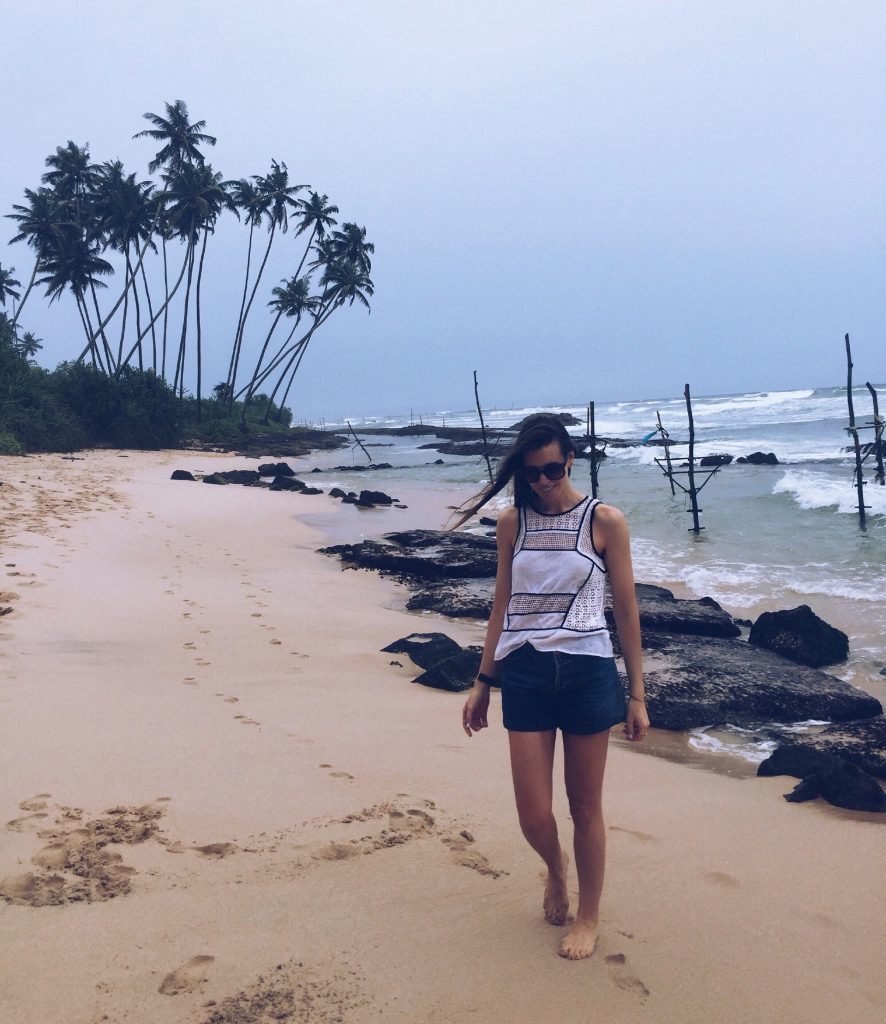 Lisa strolling on Galle Fort Beach after stilt fishing. 