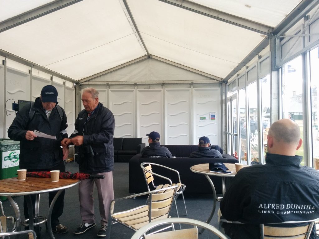 Marshals in the refreshment tent at the start of a Dunhill shift in St Andrews