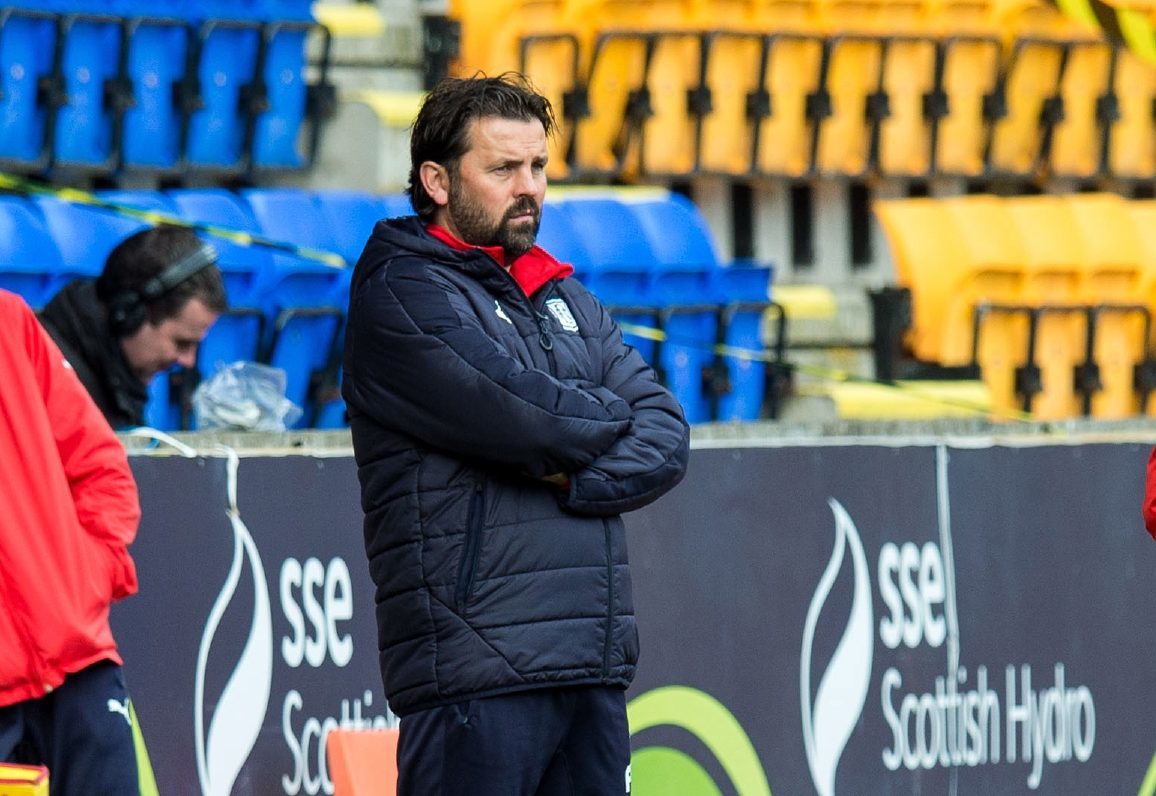 Paul Hartley watches his team lose to St Johnstone.