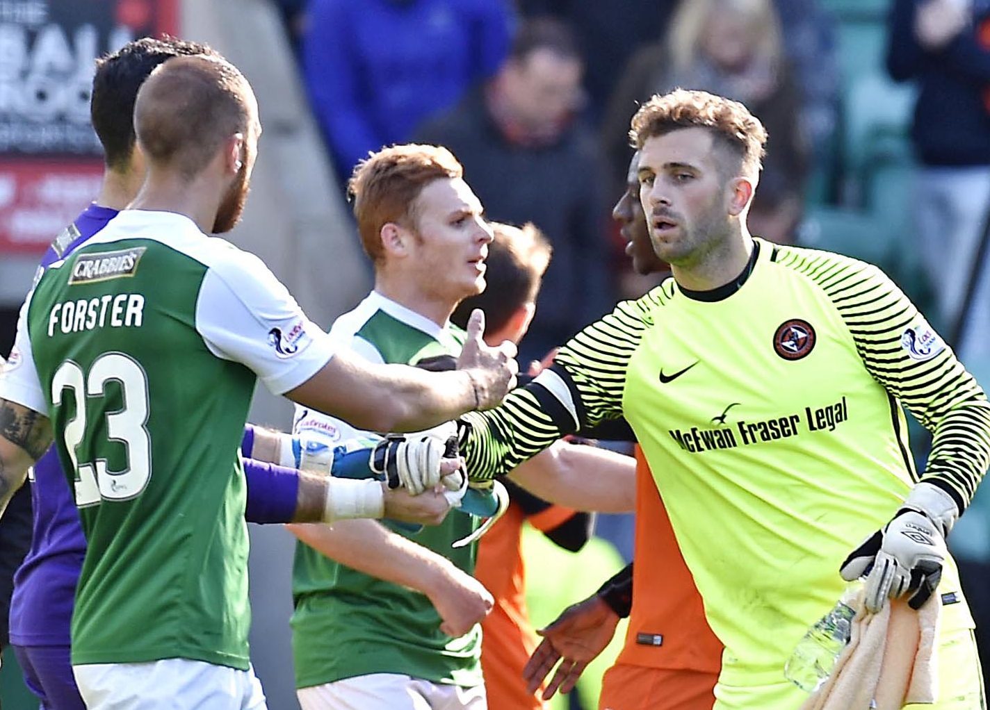 Dundee United's Cammy Bell shakes hands with Hibs' Ofir Marciano the last time the teams played.