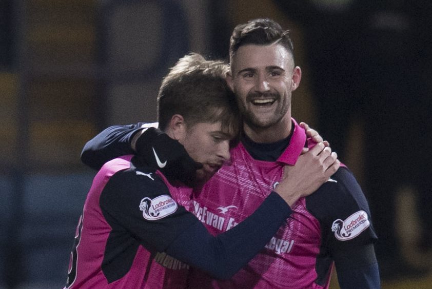 Craig Wighton celebrates with Marcus Haber.