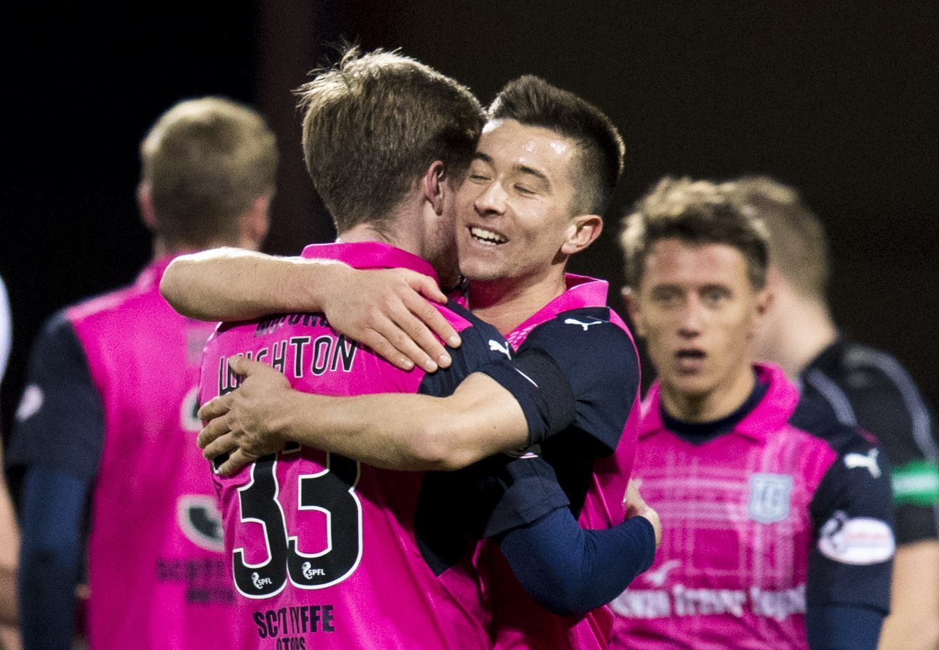 Cammy Kerr celebrates with Craig Wighton at full time.