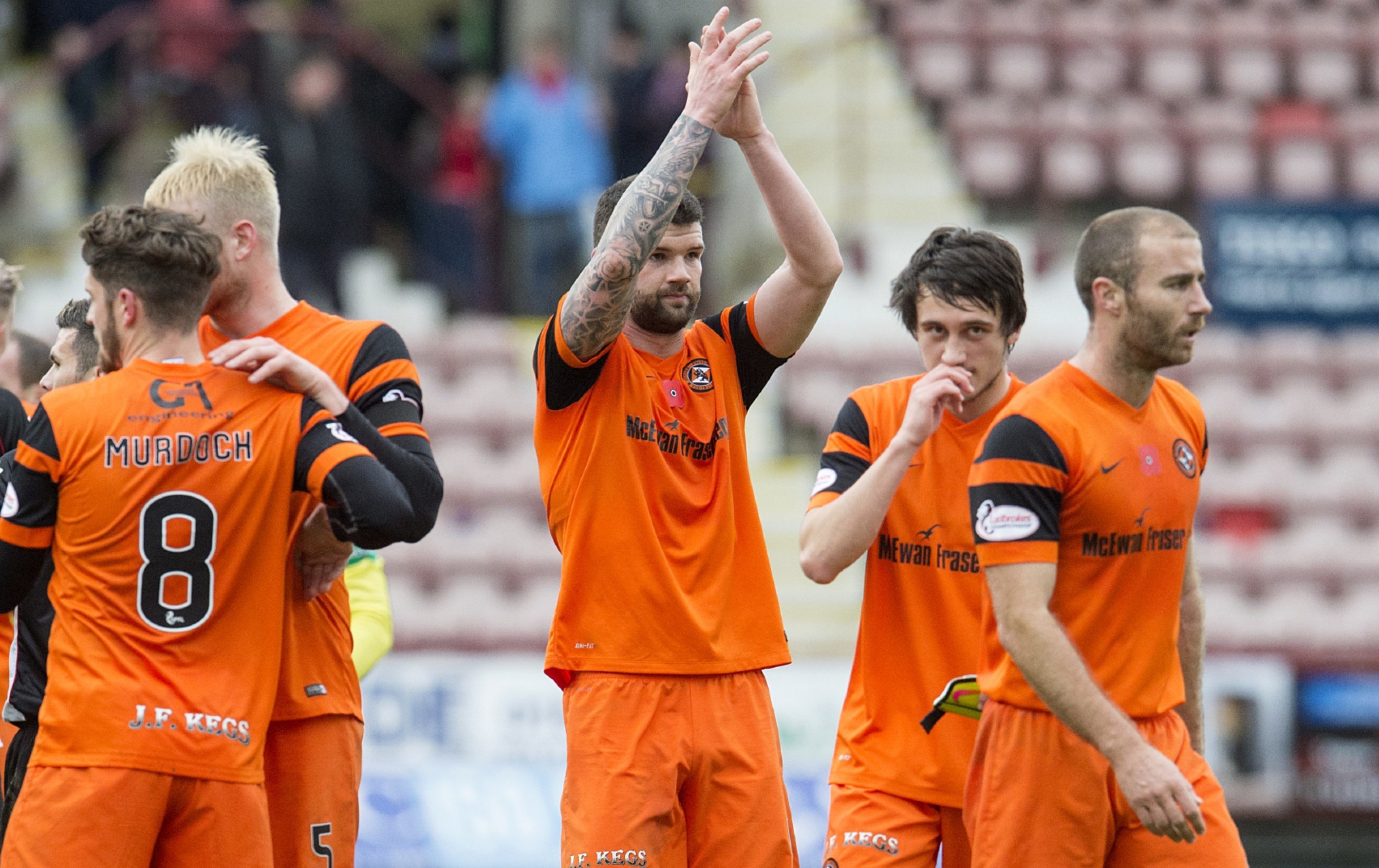 Mark Durnan applauds the United fans at full-time.