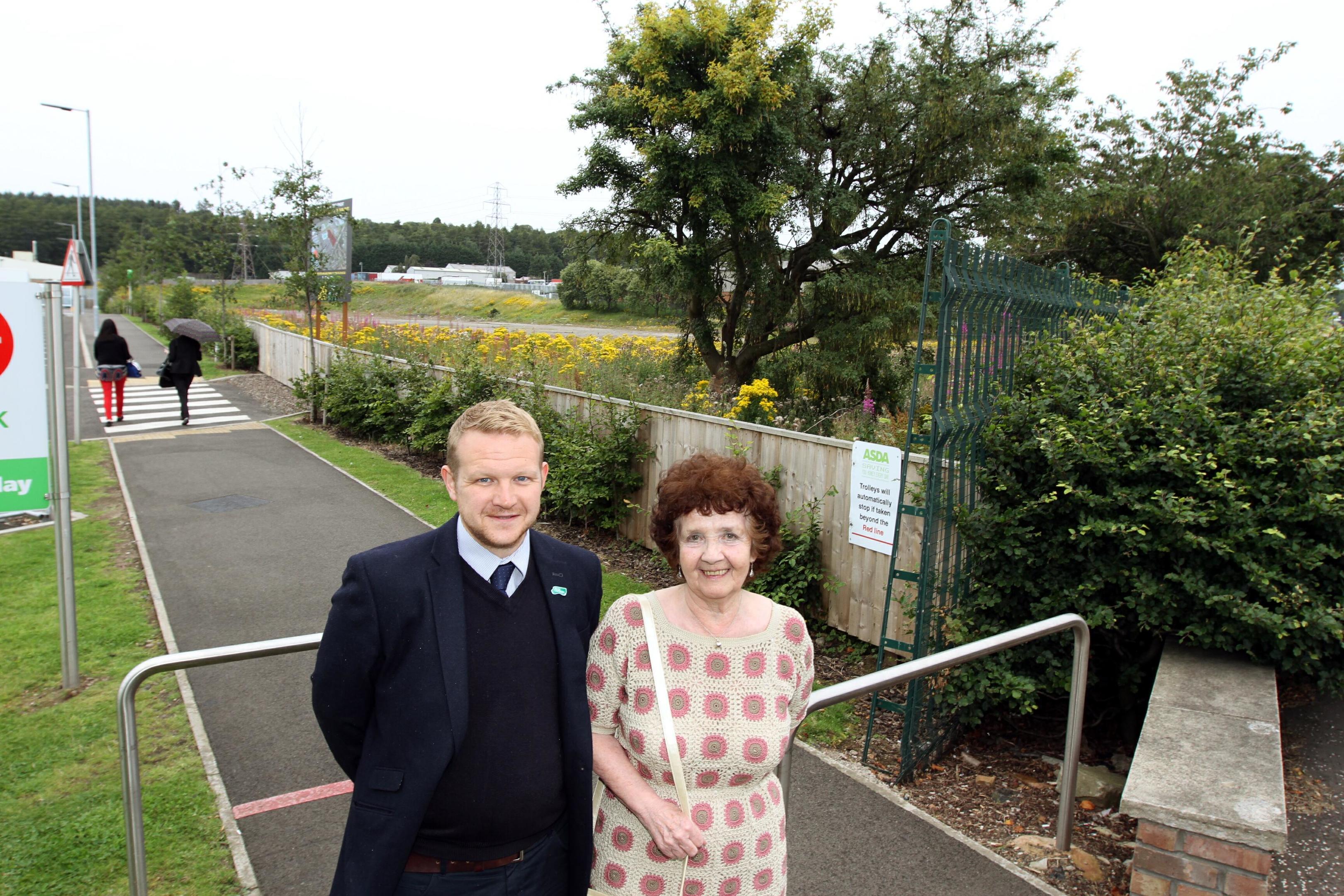 Stella, pictured with Councillor Alan Ross, at the site of the proposed store.