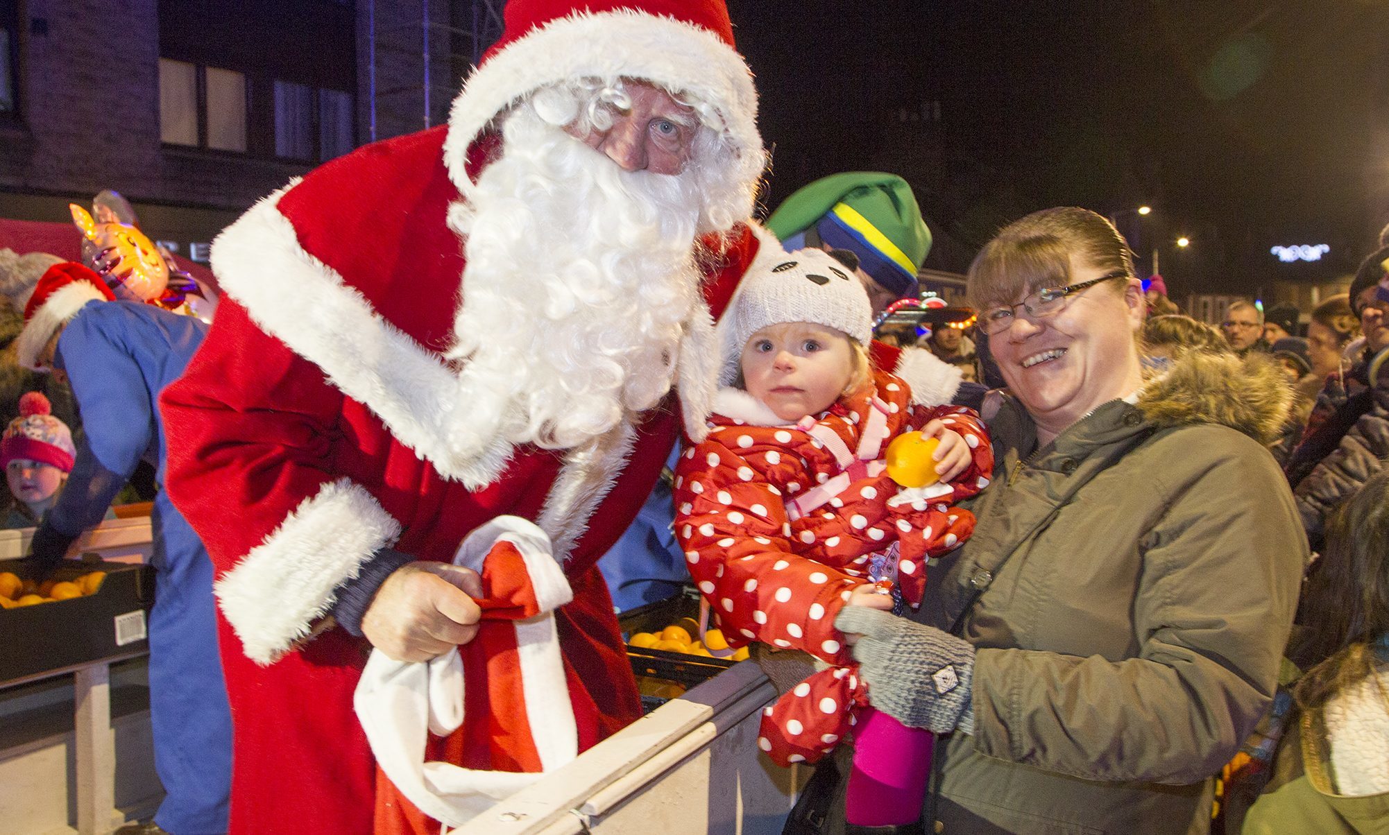 Santa meeting a young visitor at the 2016 Forfar Christmas lights switch-on.