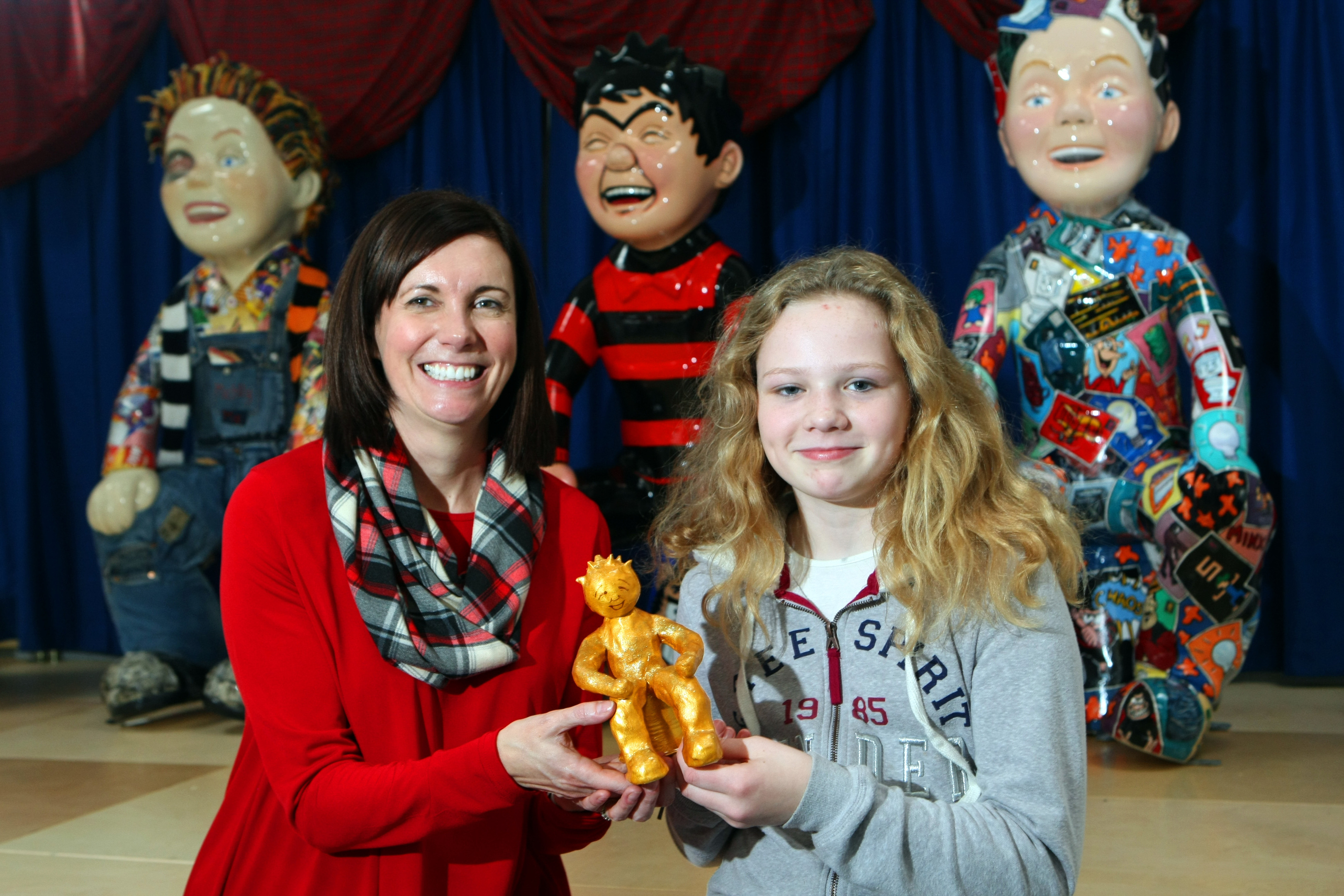 Grange PS head teacher Lorraine Will with prizewinner Georgia Carnegie.