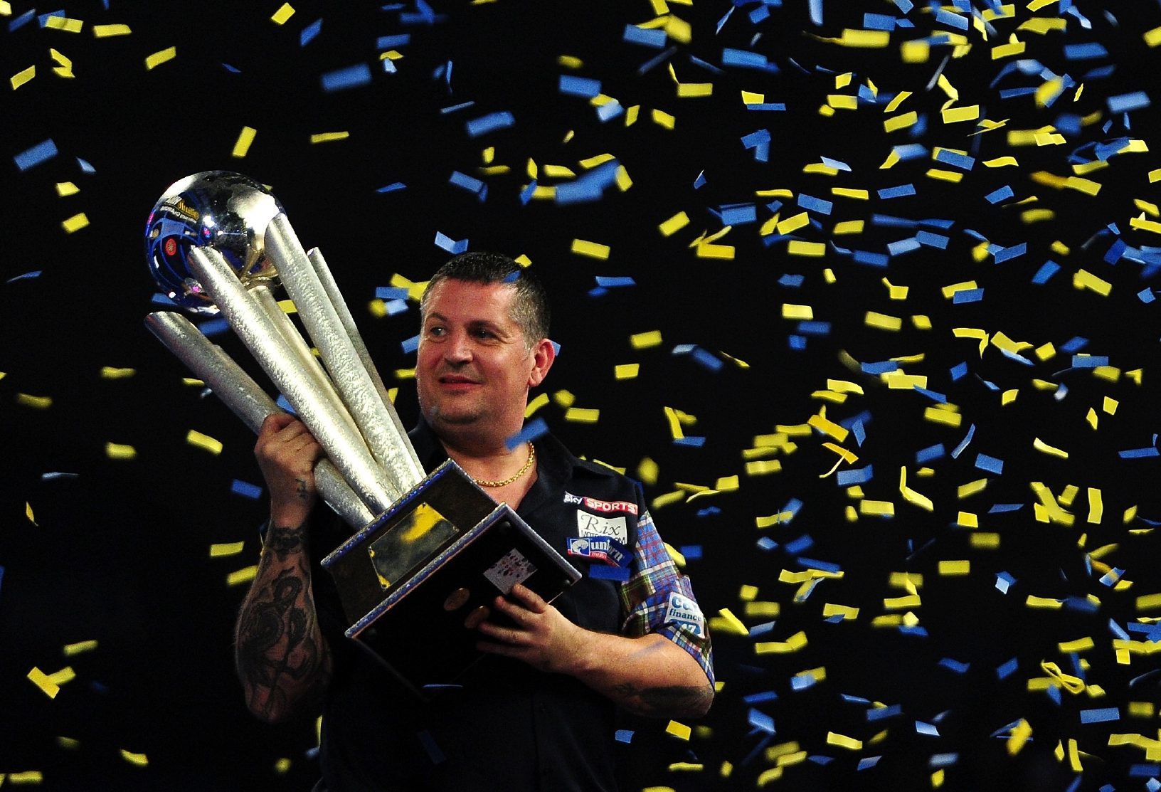 Gary Anderson the other one) celebrates with the Sid Waddell Trophy after defeating Adrian Lewis of England in the final match during Day Fifteen of the 2016 William Hill PDC World Darts Championships