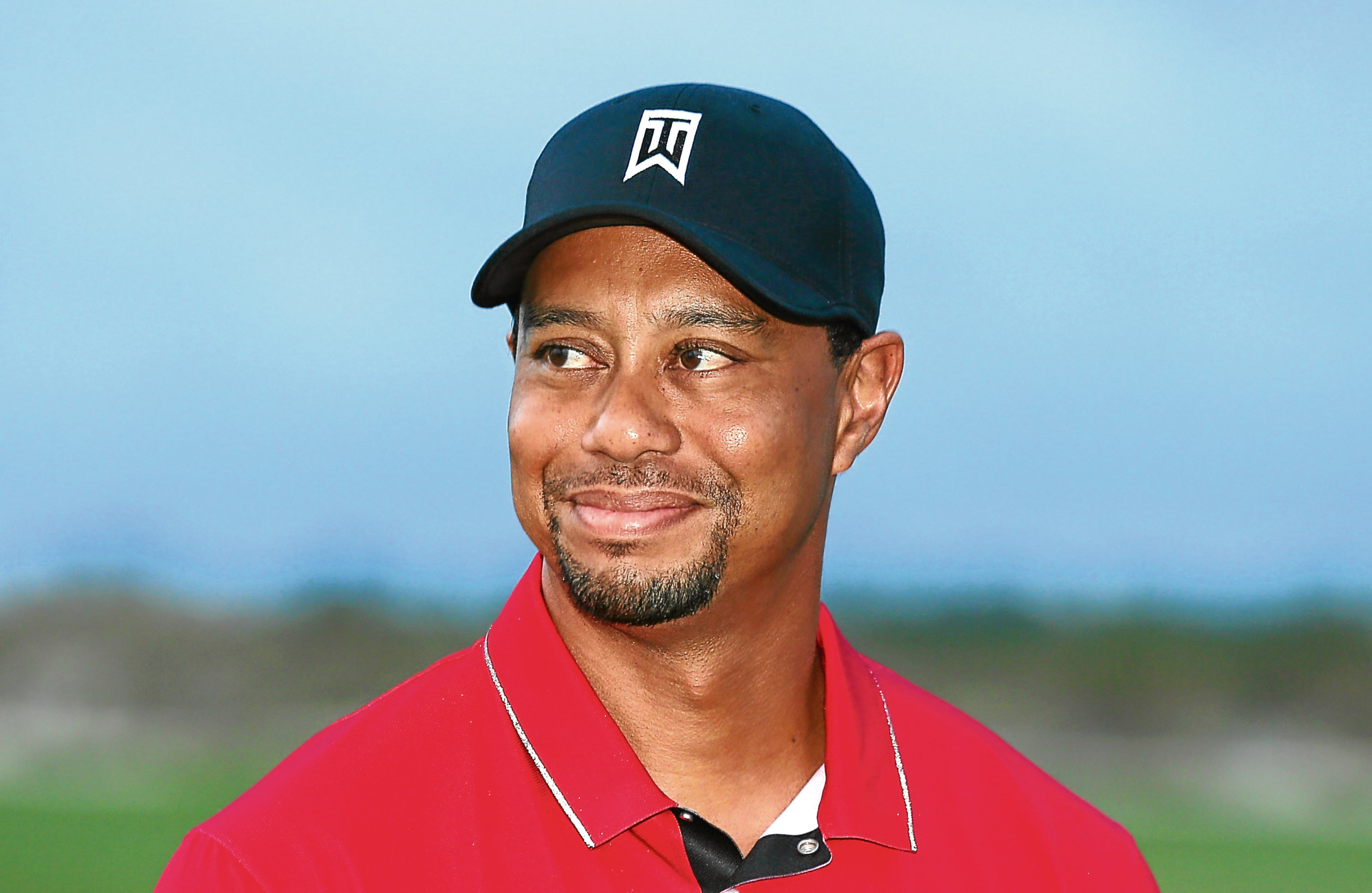 Tiger Woods is smiling again.