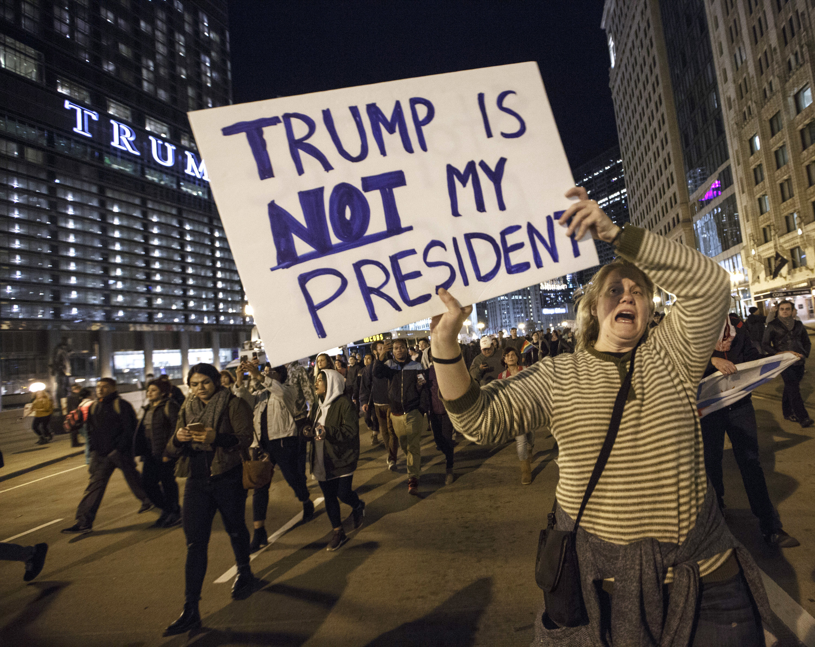 Demonstrators protest outside the Trump Tower in Chicago, Illinois.