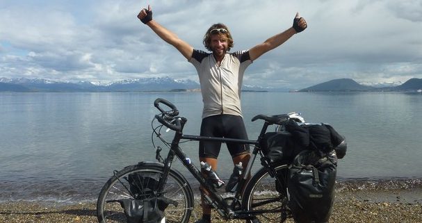 Mark Beaumont celebrates after finishing his Cycling the Americas adventure in Argentina