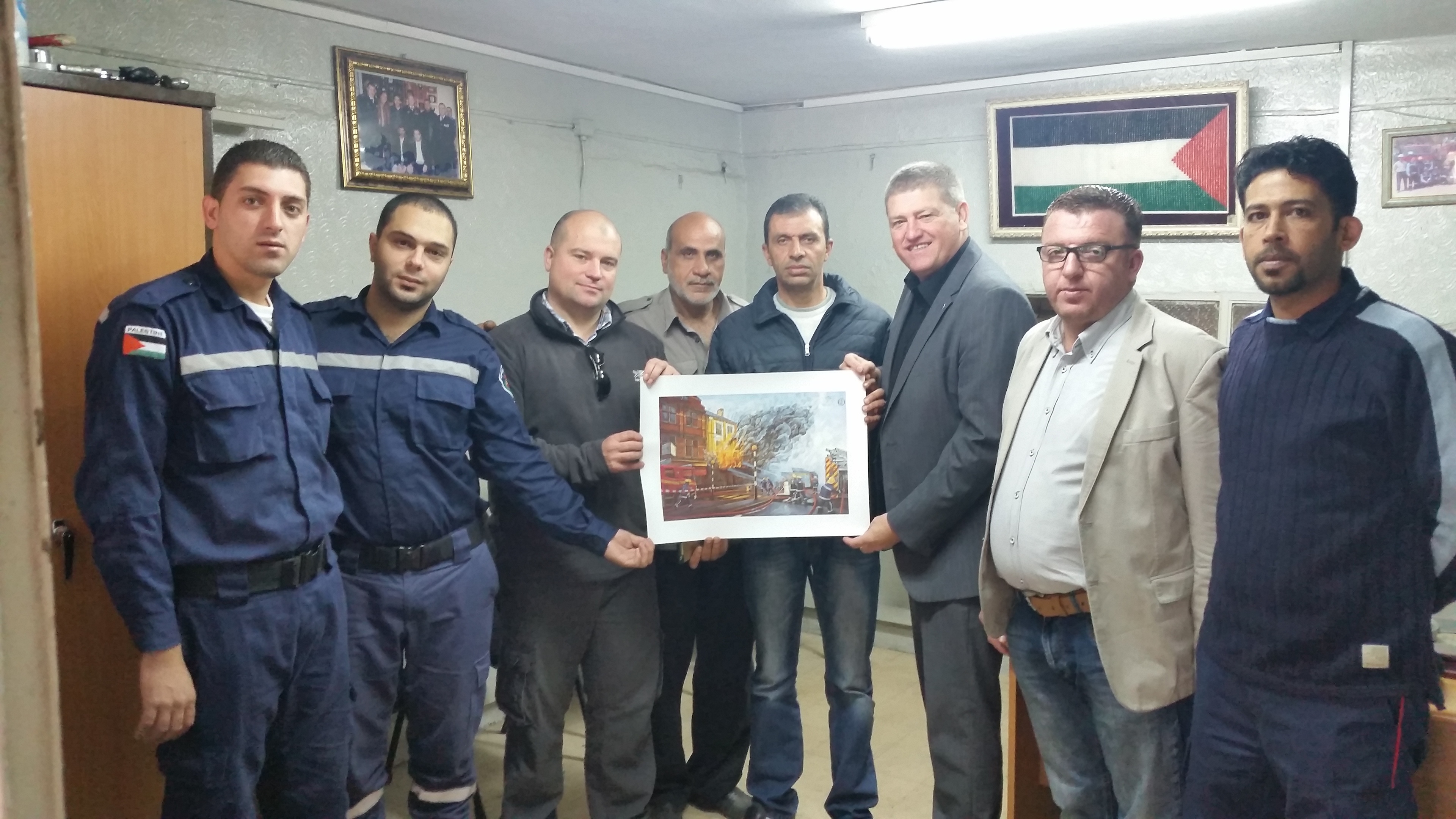 Jim Malone with local firefighters on a previous trip to Palestine.