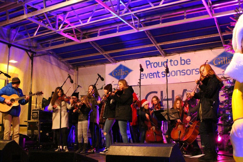 The Tayside Young Fiddlers entertain the crowds at the switch on of the Broughty Ferry Christmas lights.