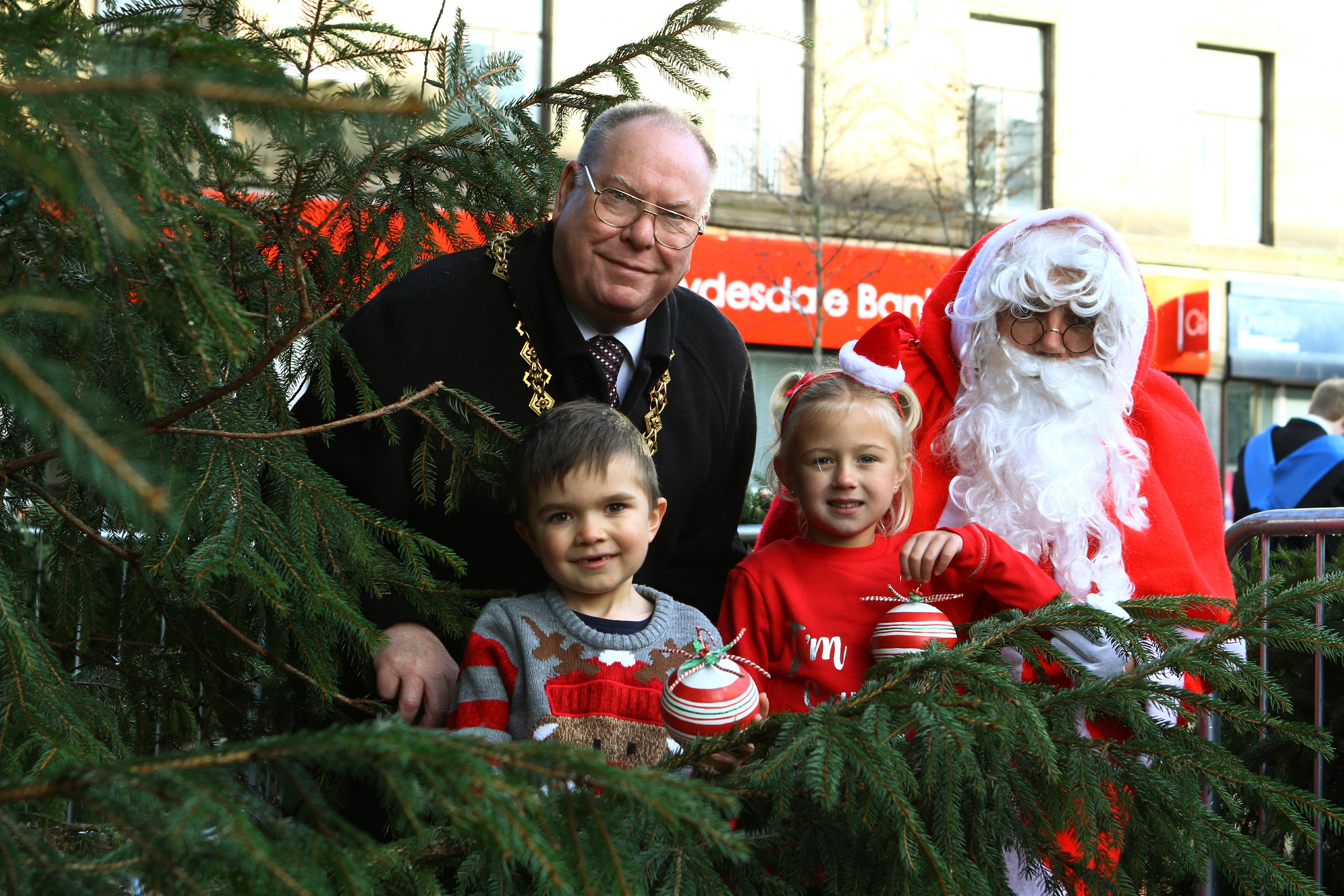 Lord Provost Bob Duncan with Santa, and JJ Brown, left, and Zoe Milton from Showcase The Street.