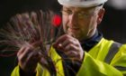 Openreach engineer Alistair Mcgowan working on the rollout of high-speed fibre broadband.