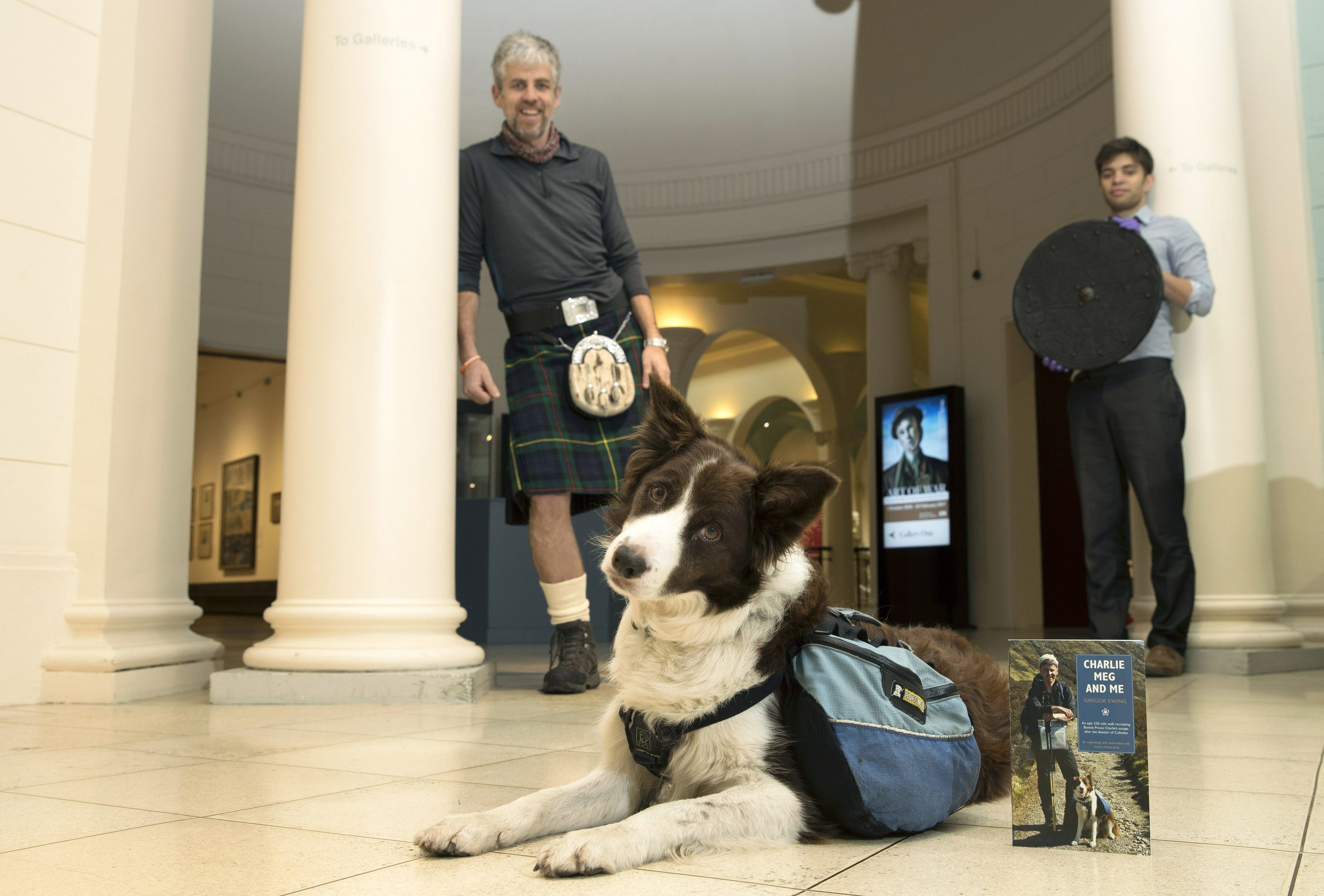 Gregor Ewing with his dog Meg pictured with Perth Museum and Art Gallery Curator JP Reid who is holding a targe from a Highland Jacobite soldier.