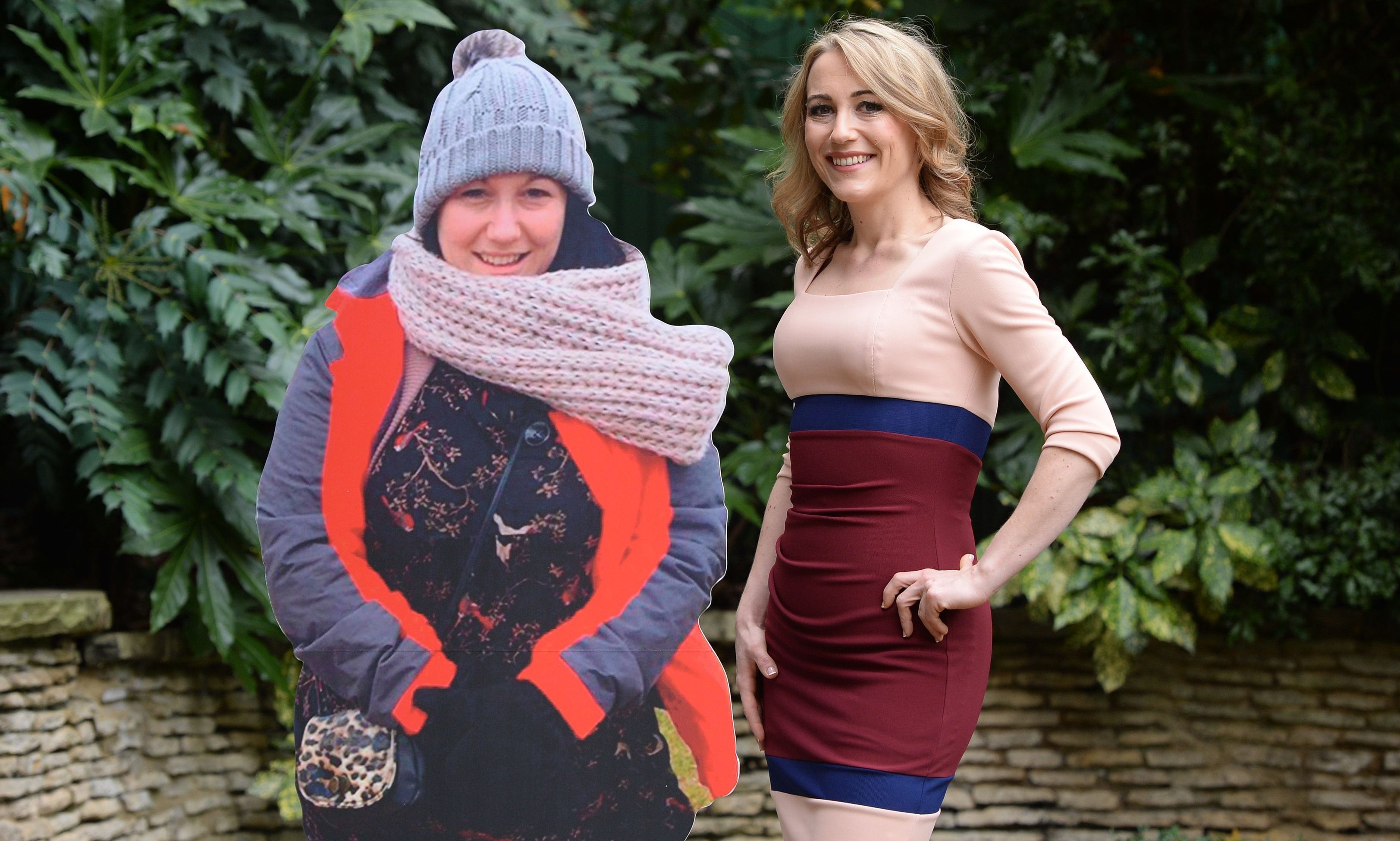 Hollie Barrett, 30, from Blunderston in Suffolk, poses with a cardboard cut-out of her former self.