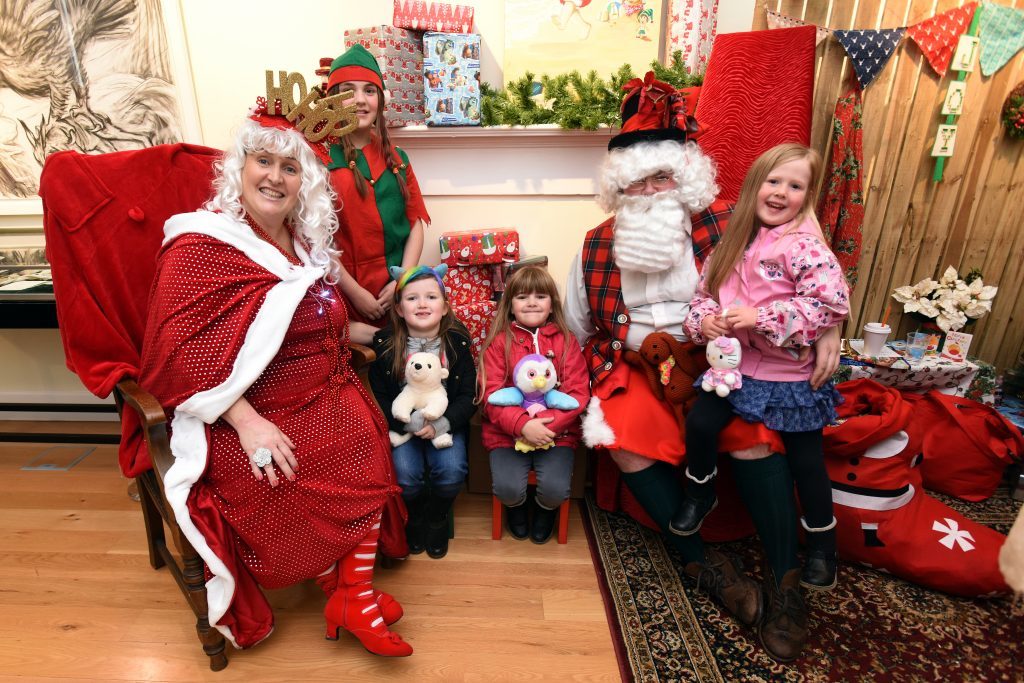 Santa along with Mrs Claus and one of their elves entertain l to r - Kirsten McDonald, Rachel O'Hara and Laurie McKenzie at Townhouse Museum, Brechin