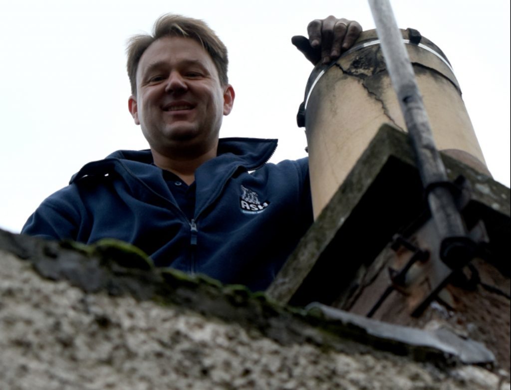 Simon Mappin of Ash Chimney Services repairs a chimney pot at a cottage near Forfar.