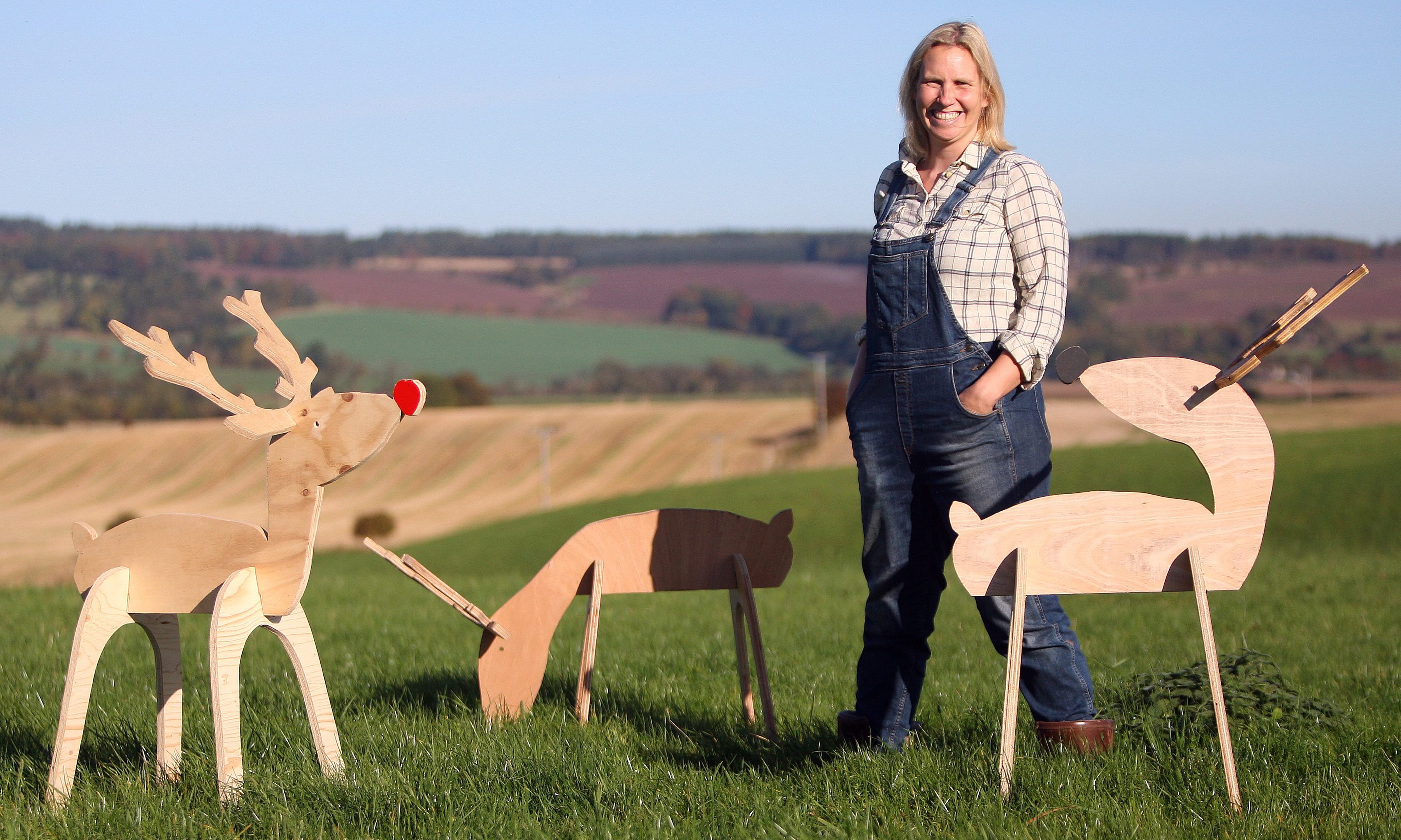 Ellen Watt with some of the festive wooden reindeer she makes at Drumtogle Farm