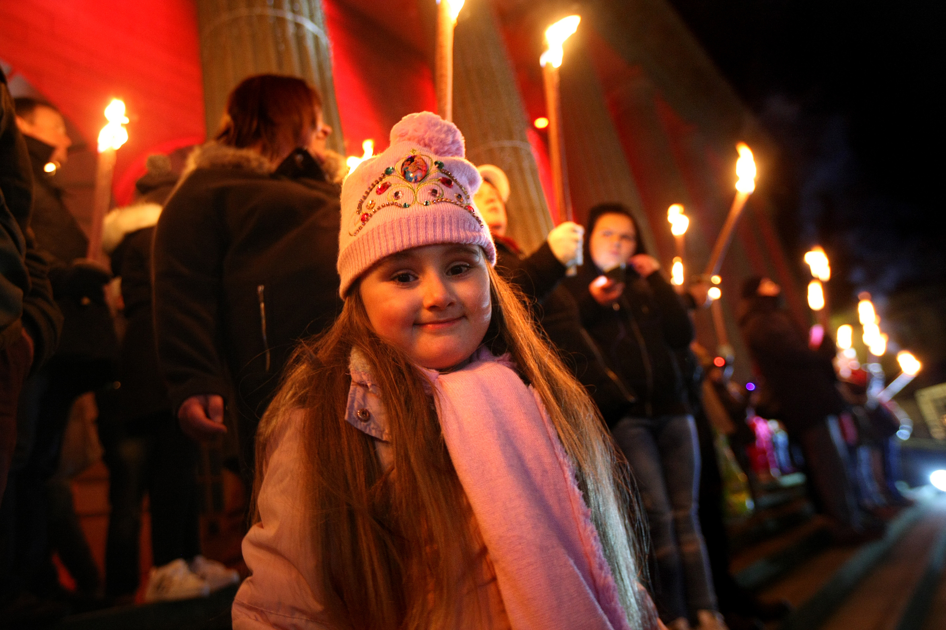 Layla Robson enjoys the torchlit procession, which made it's way from High School of Dundee to the city square.